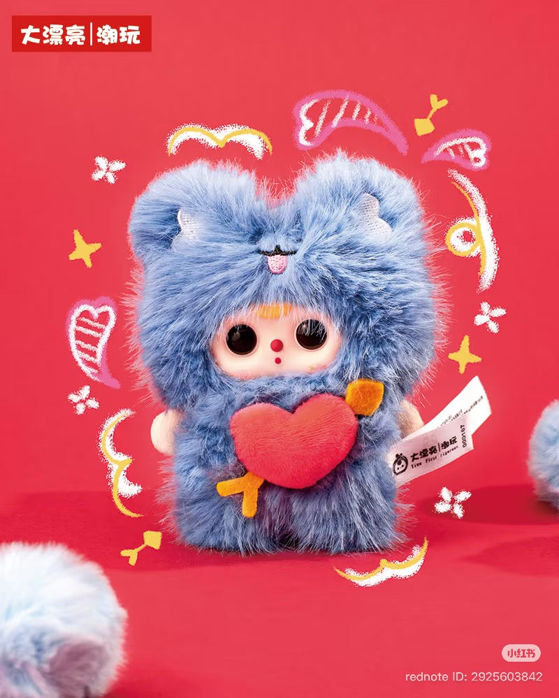 Baby Three - Cupid Plush Blind Box doll in a blue animal suit with ears, holds a red heart; set against a red doodle background.