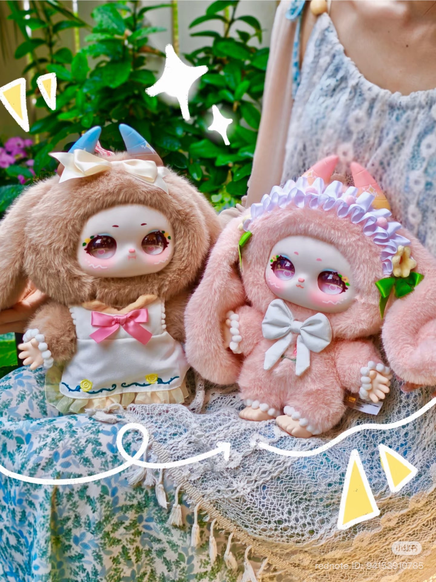 Two kawaii plush dolls from Samael Misty Garden 400% Plush Series Blind Box, in fuzzy costumes with floppy ears and horns, seated on lace.