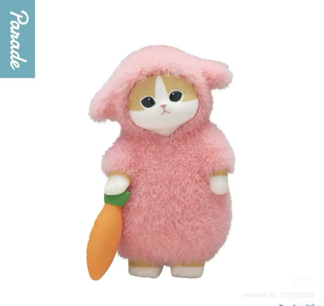 Mofusand Fluffy Pajama Figure Blind Box: Cat figurine in a pink bunny onesie, holding a carrot. Preorder for end of Q4 2025.
