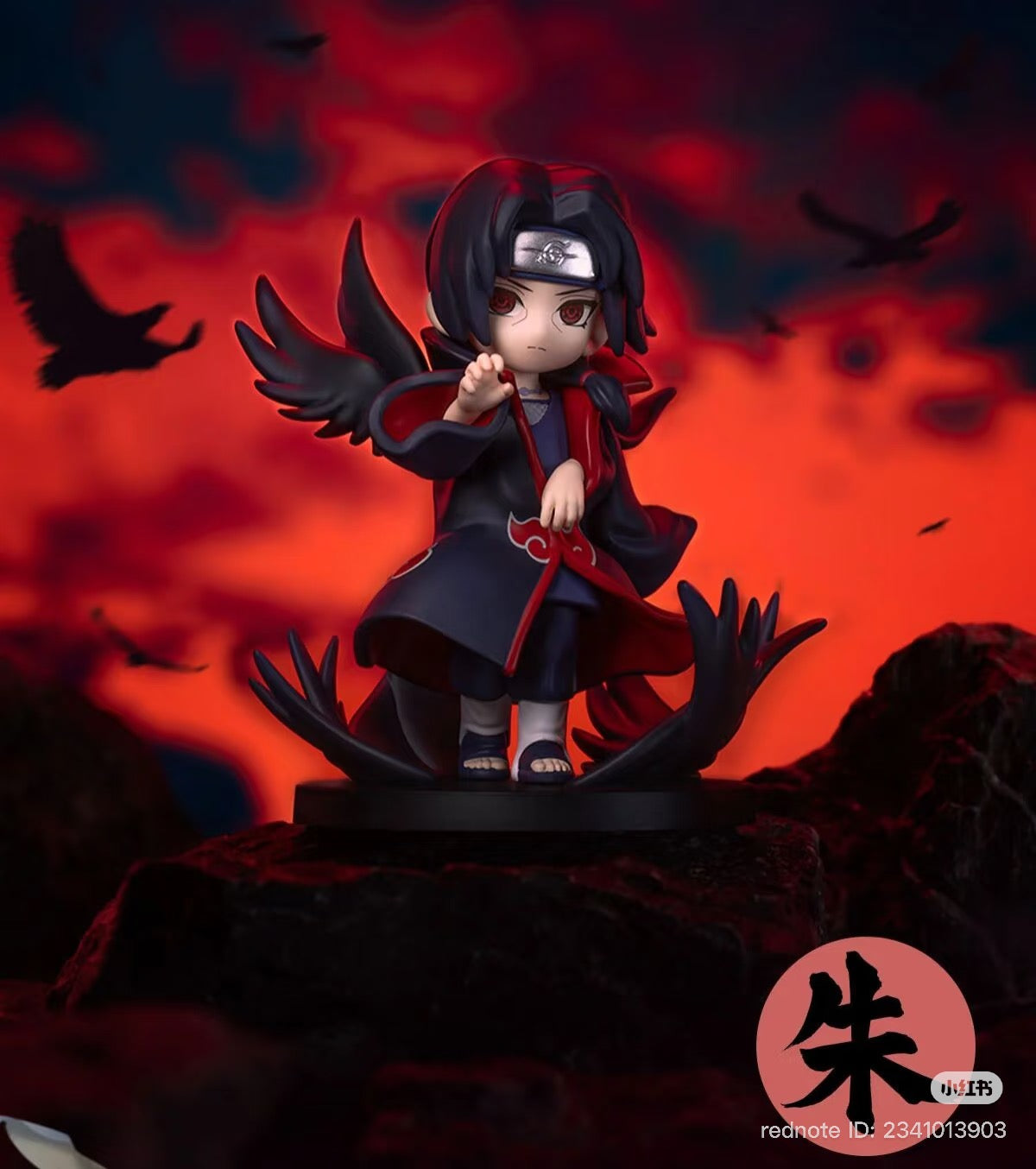 Chibi-style Itachi Uchiha figure from Naruto: Shippuden Series Battle Against Akatsuki, featuring Akatsuki cloak and crows, on display base.