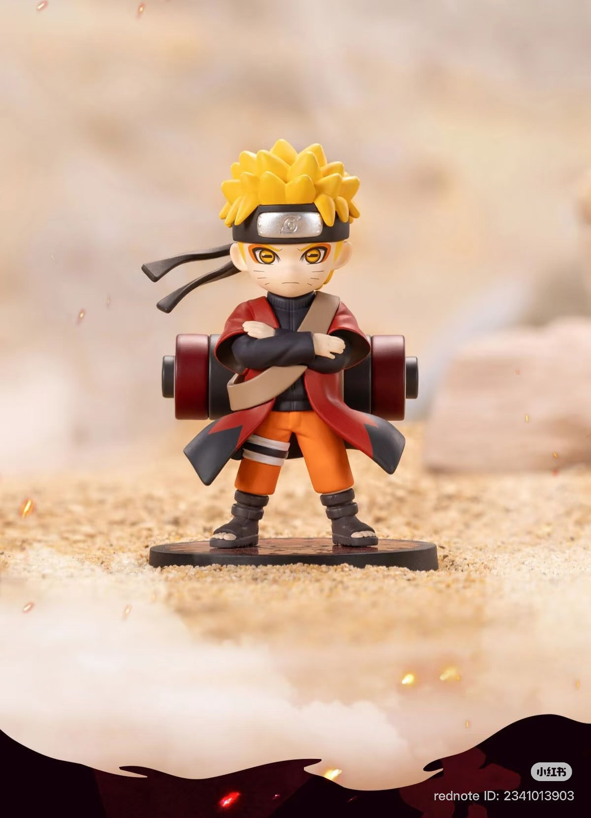 Chibi Naruto Uzumaki figure from the Naruto: Shippuden Series, arms crossed, with scroll, on display base. Preorder for Q4 2025.