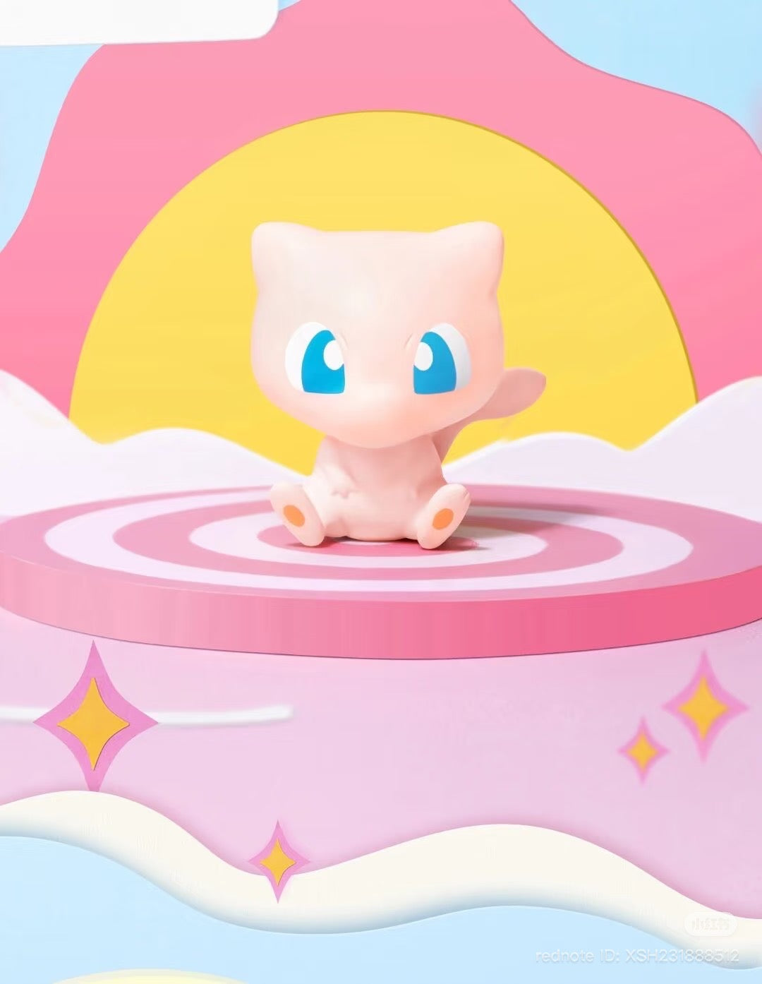 Pokémon Mini Adventure Series 3 Display Figure featuring a pink, cat-like creature on a patterned platform, set against a whimsical pastel backdrop.
