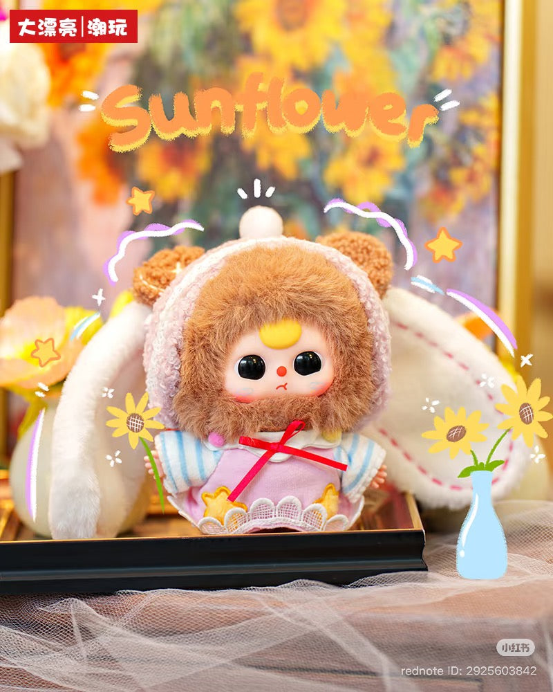 Plush doll in pink lace outfit with bunny ears from Baby Three - Sweet Dreams Plush Blind Box, surrounded by sunflower doodles, part of a blind box series.