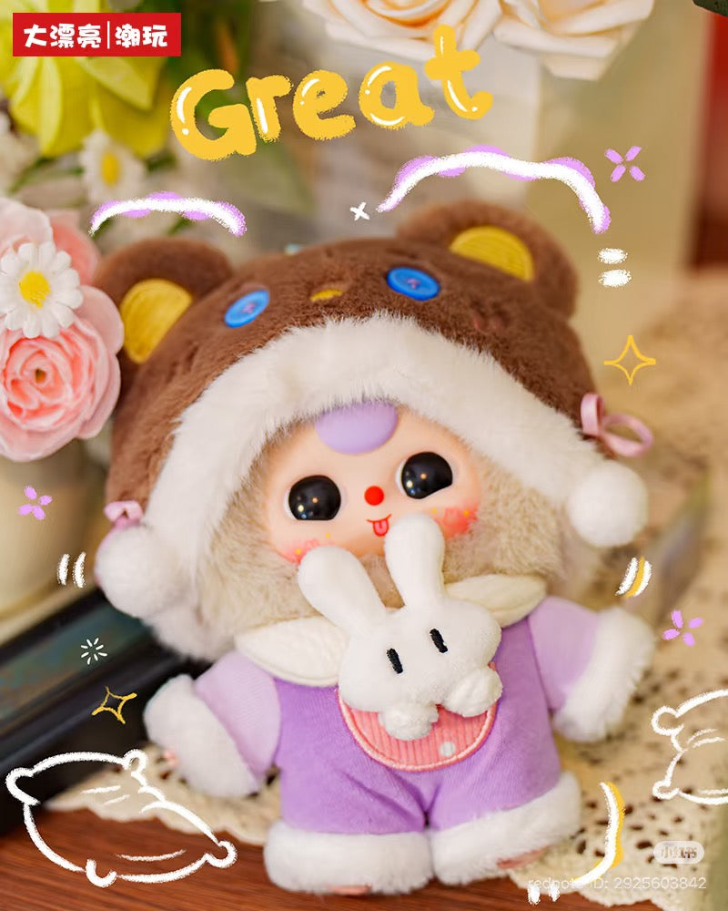 Baby Three - Sweet Dreams Plush Blind Box features a plush figure in a bear hood with pom-pom ties, holding a tiny bunny, surrounded by playful doodles.