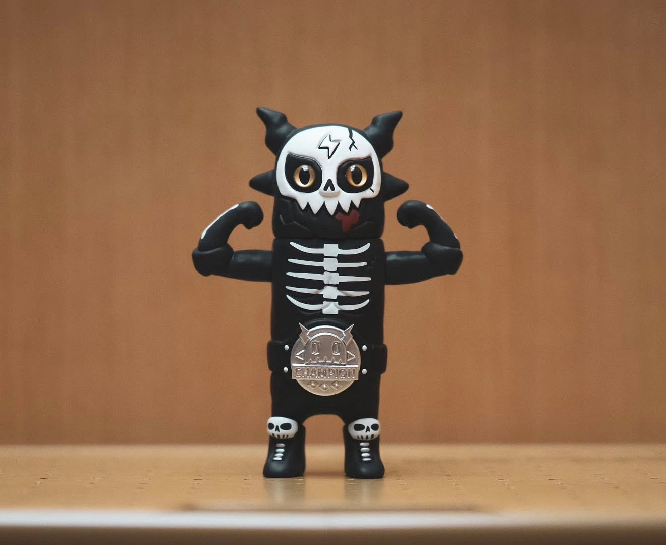 OWEN The Champion Black by ODOM, a vinyl figurine with a skull face and CHAMPION belt, preorders for Jan 2026 at Strangecat Toys.