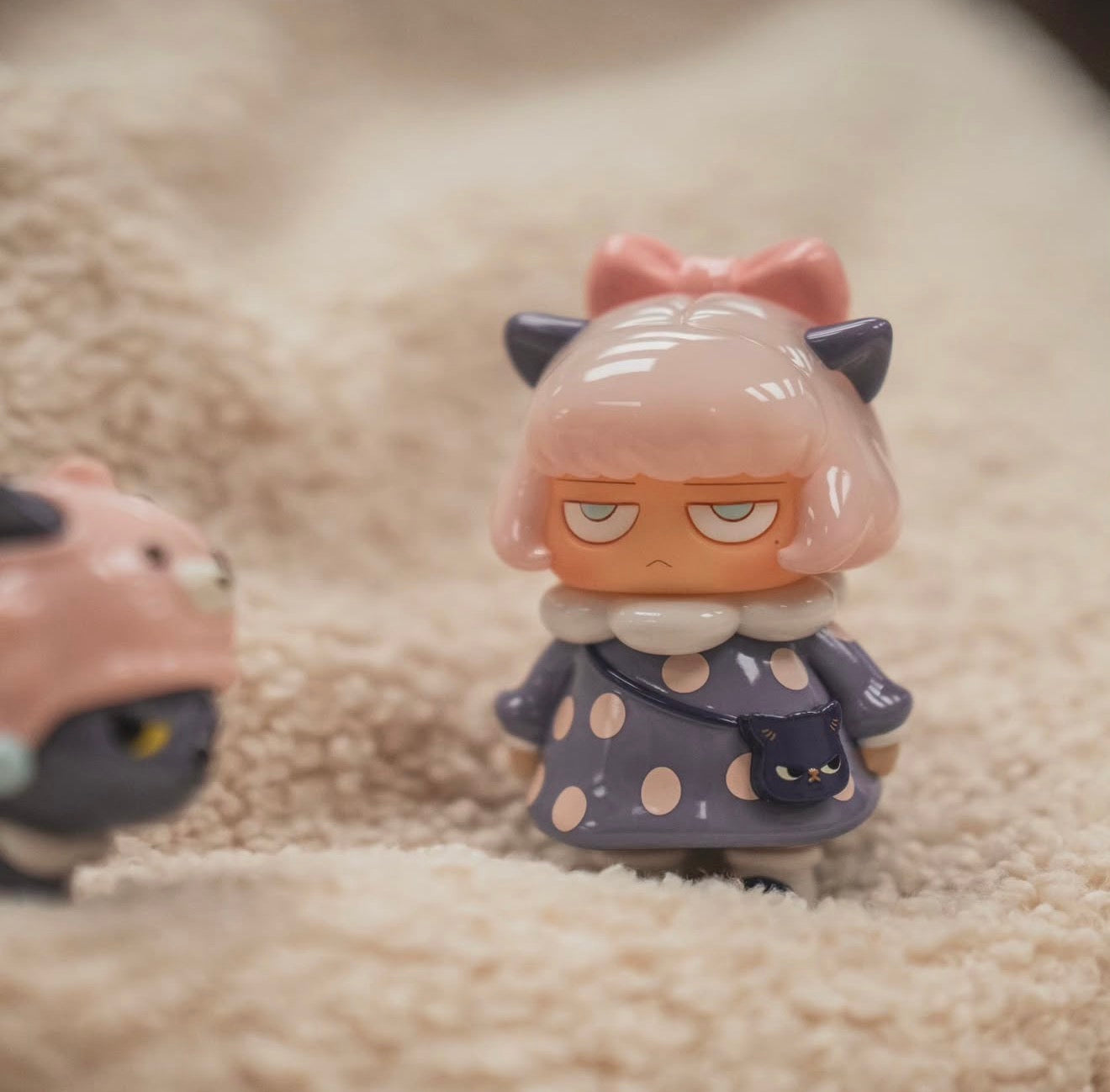 Poh x Morimei works Soft Vinyl Set 2 features a grumpy girl figurine with pink bob hair and a tiny cat-face purse, available for preorder.