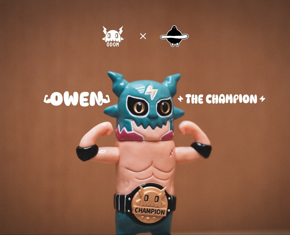 OWEN The Champion by ODOM vinyl toy, featuring a flexing wrestler with teal mask, gold championship belt; available for preorder, shipping January 2026.