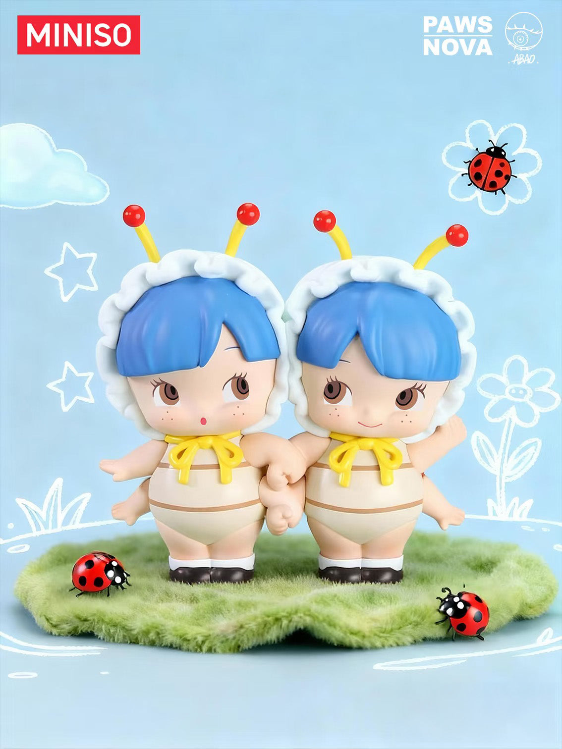 Floral Concerto by Abao: Two chibi-style vinyl figures with blue hair, holding hands on faux grass, surrounded by ladybugs, evoking a playful, storybook charm.