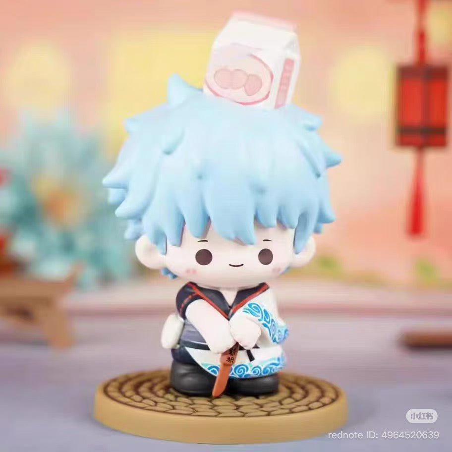 Gintama Moe Series Vol.1 Blind Box figurine with light-blue spiky hair, kimono, and Zongzi motif, set against a festive backdrop.