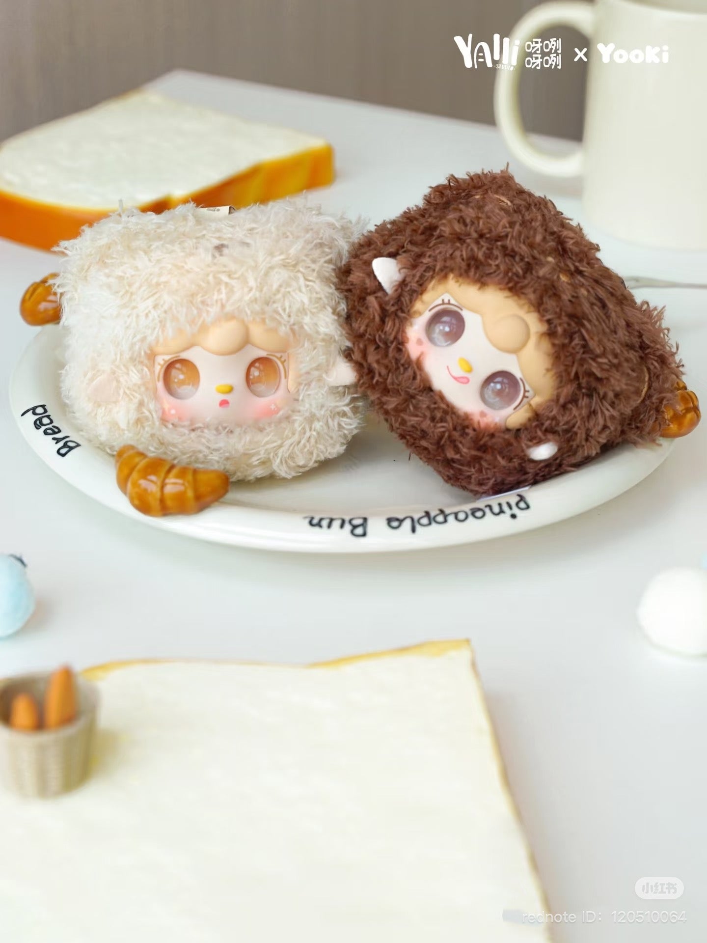 Yooki - Little Bear Bun Mini Keychain Plush Blind Box displayed on a plate, part of a preorder series with 8 designs and 2 secret options.