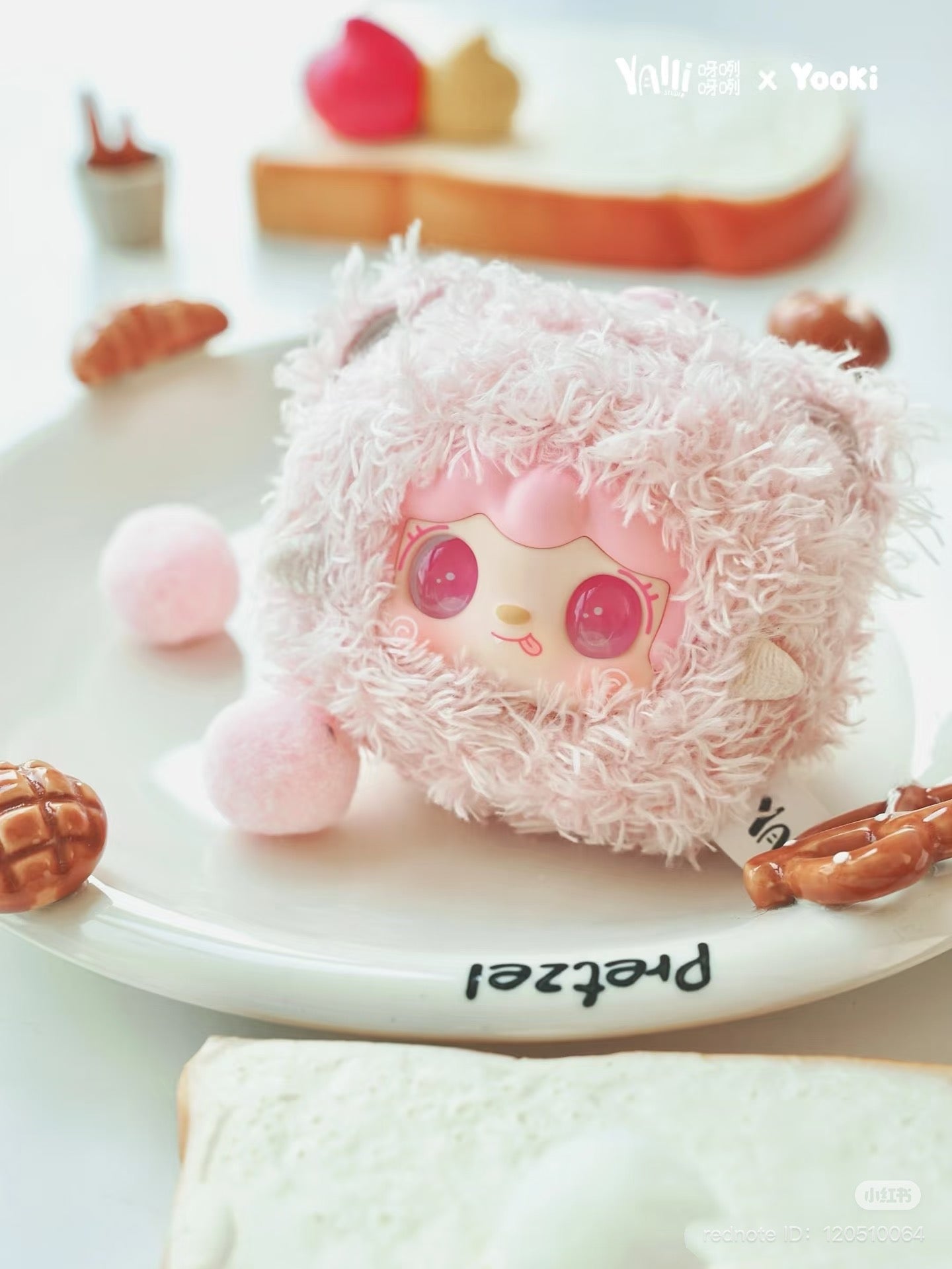 Yooki - Little Bear Bun Mini Keychain Plush from Strangecat Toys, shown as a preorder item, featuring a pink stuffed bear on a plate.