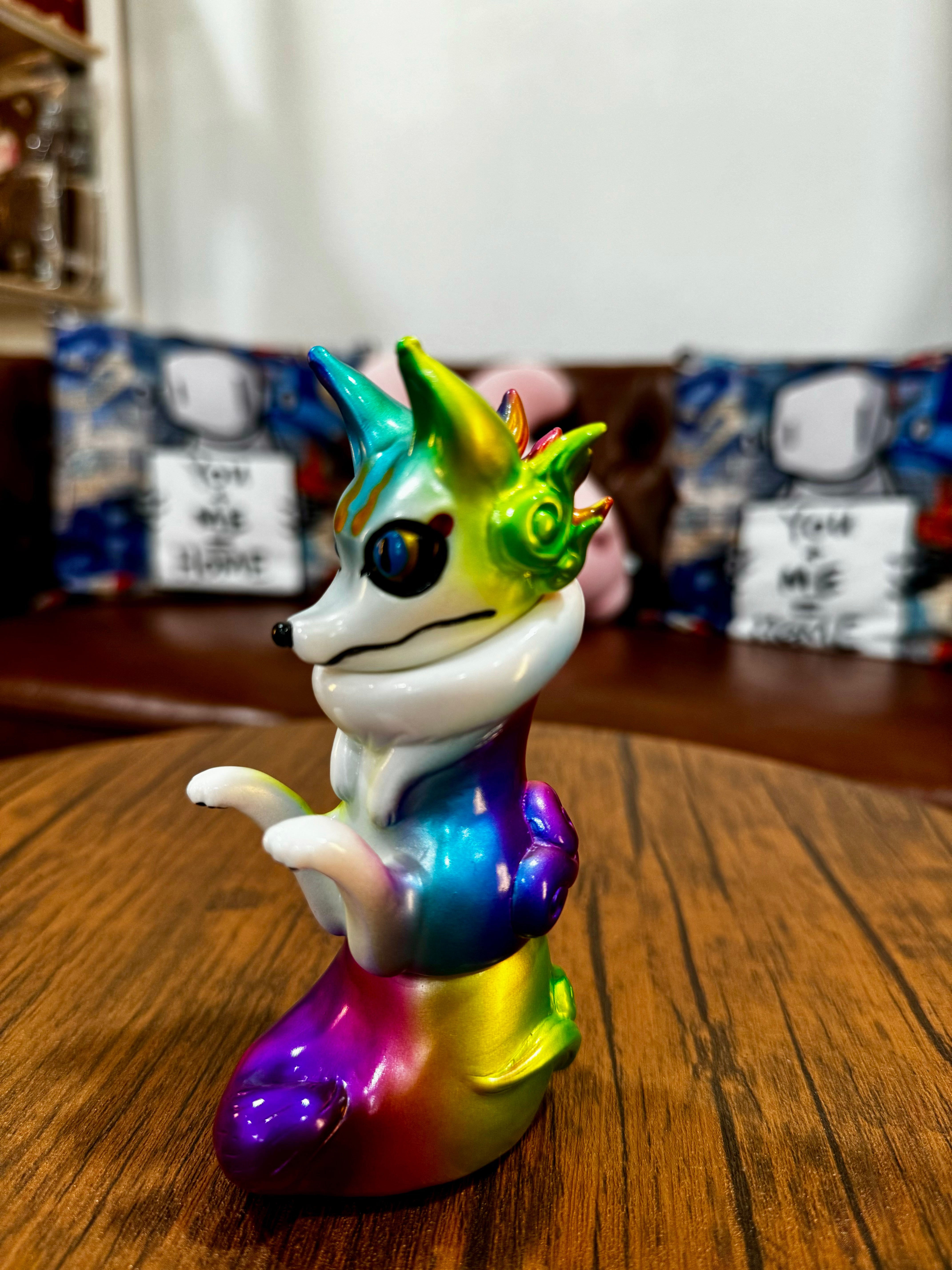 Urukoma - Metallic Rainbow by YASU, a 13cm colorful animal figurine, limited to 25 pieces, displayed on a wooden surface.