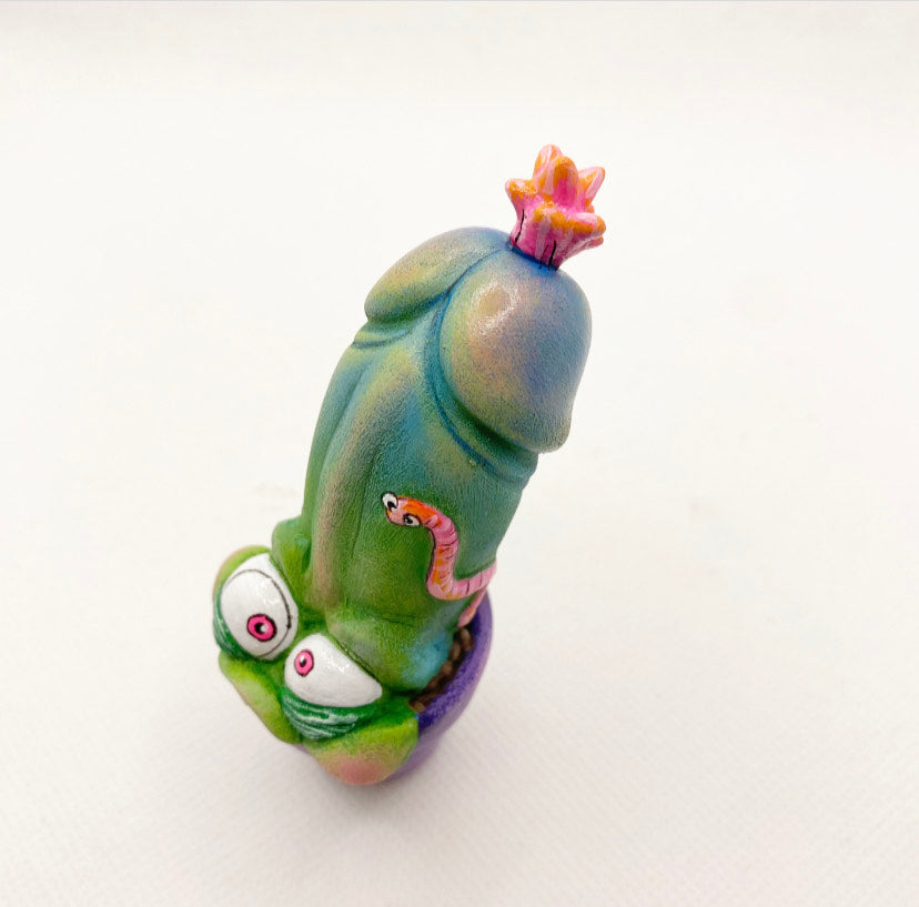 Toy figurine of a green and blue animal with a worm on top, custom design by Simon Says Macy, from Strangecat Toys.