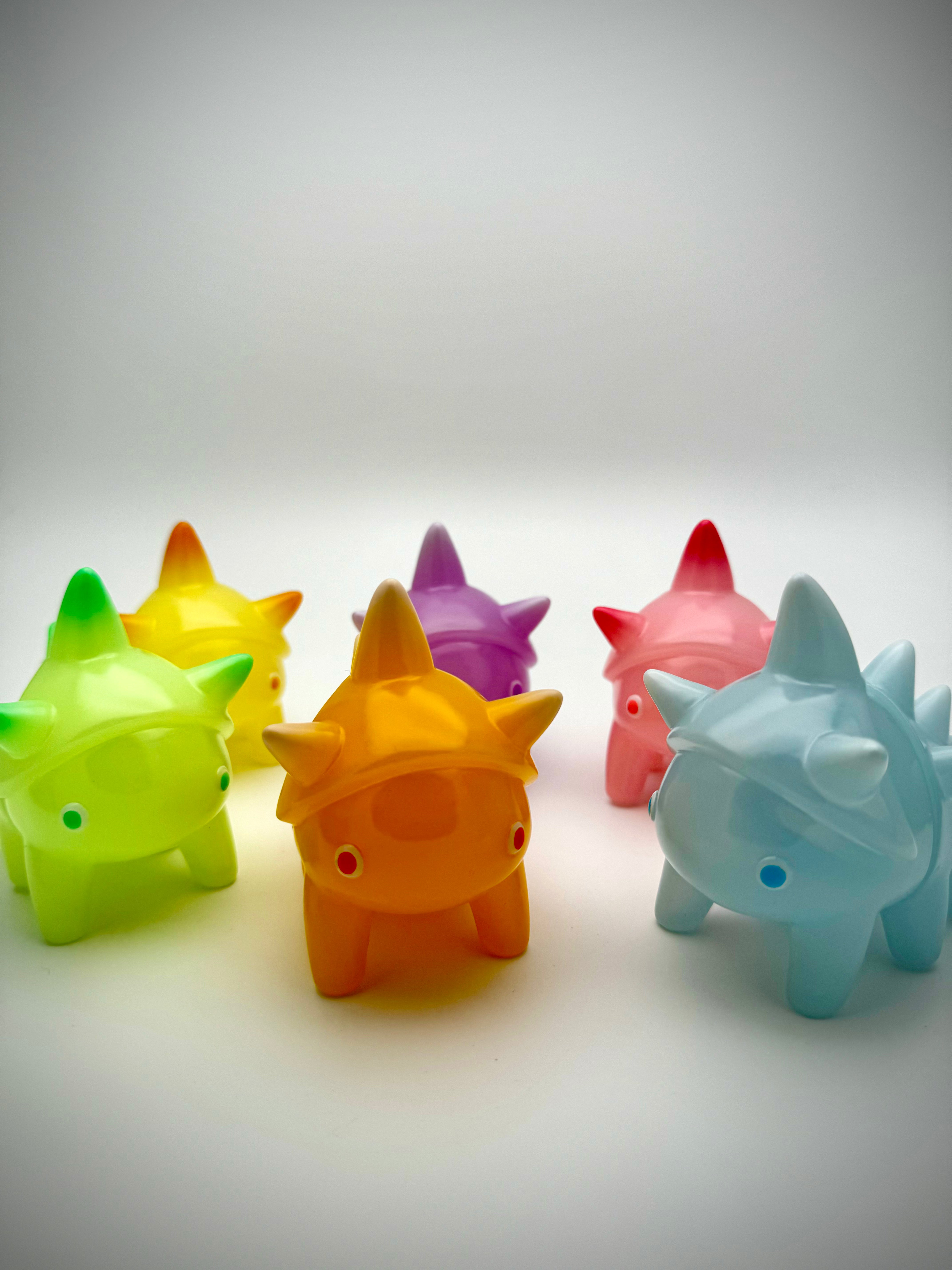 Tawashi - Jelly Beans by Hanamusic: Group of colorful plastic animals and toys, including a close-up of a toy cone.