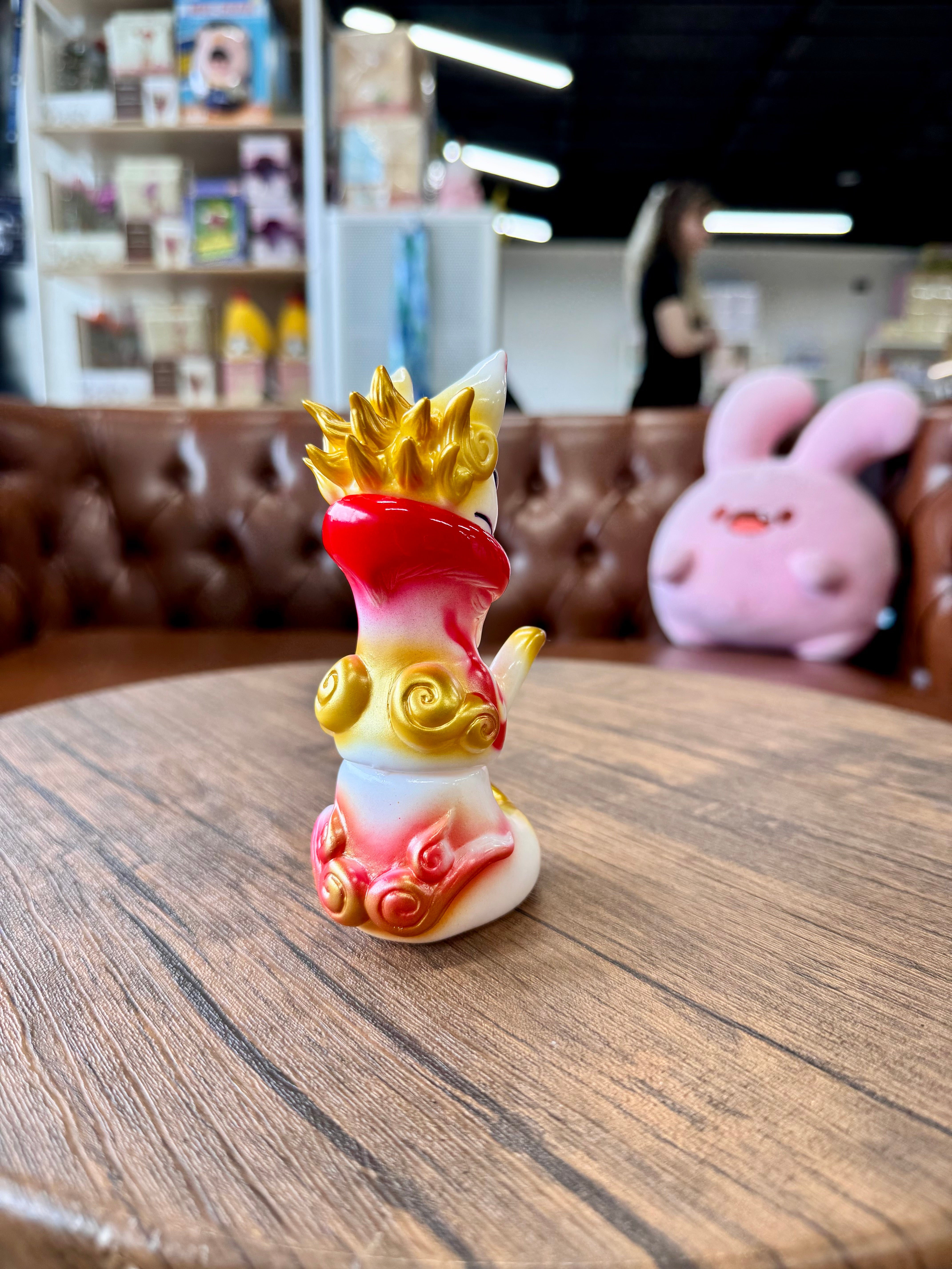 Urukoma - Inari by YASU, a 13cm Japanese Sofubi figurine, displayed indoors atop a table, epitomizes the unique art toys of Strangecat Toys.