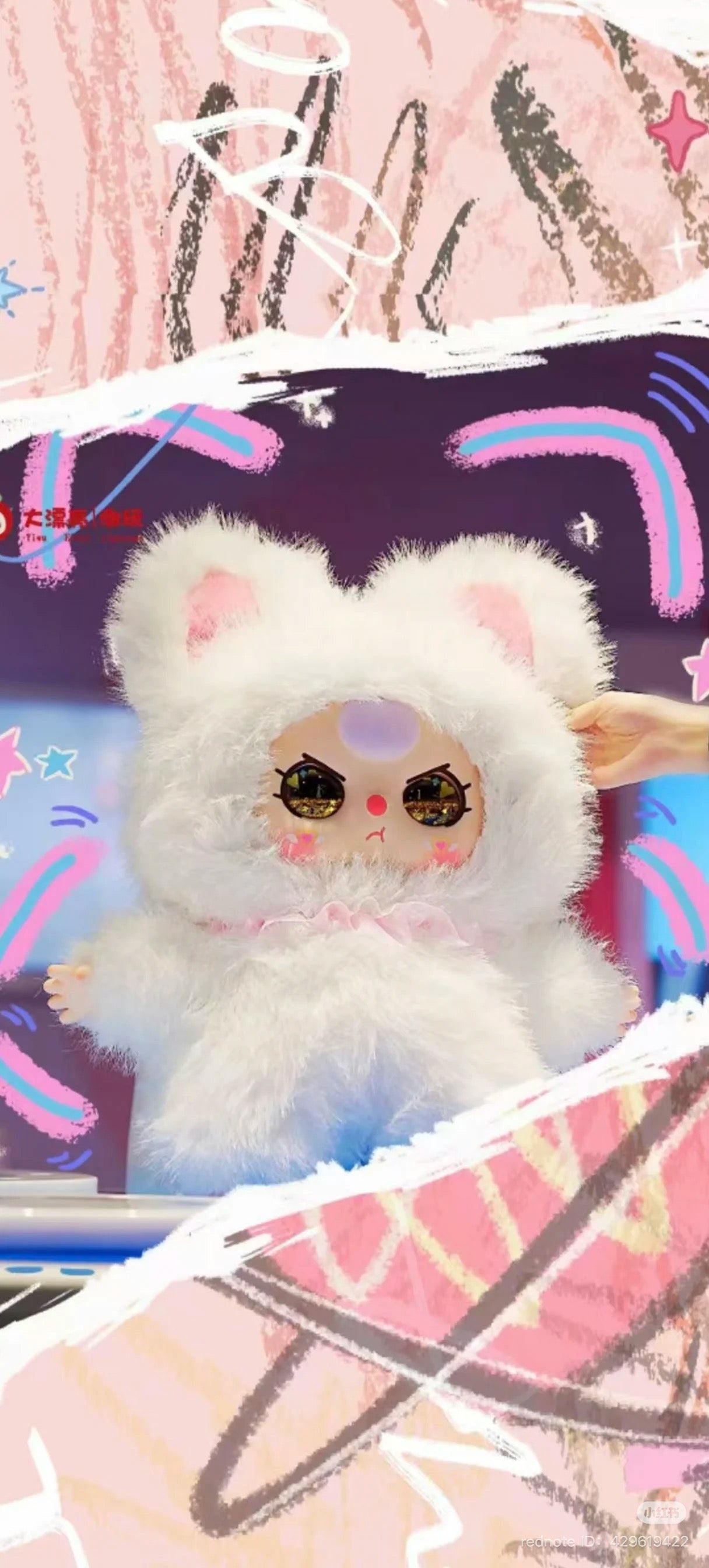 Baby Three AI 800% plush toy, featuring a cartoon cat design, held in hand. Preorder available, oversized shipping applies. Part of Strangecat Toys' unique collection.