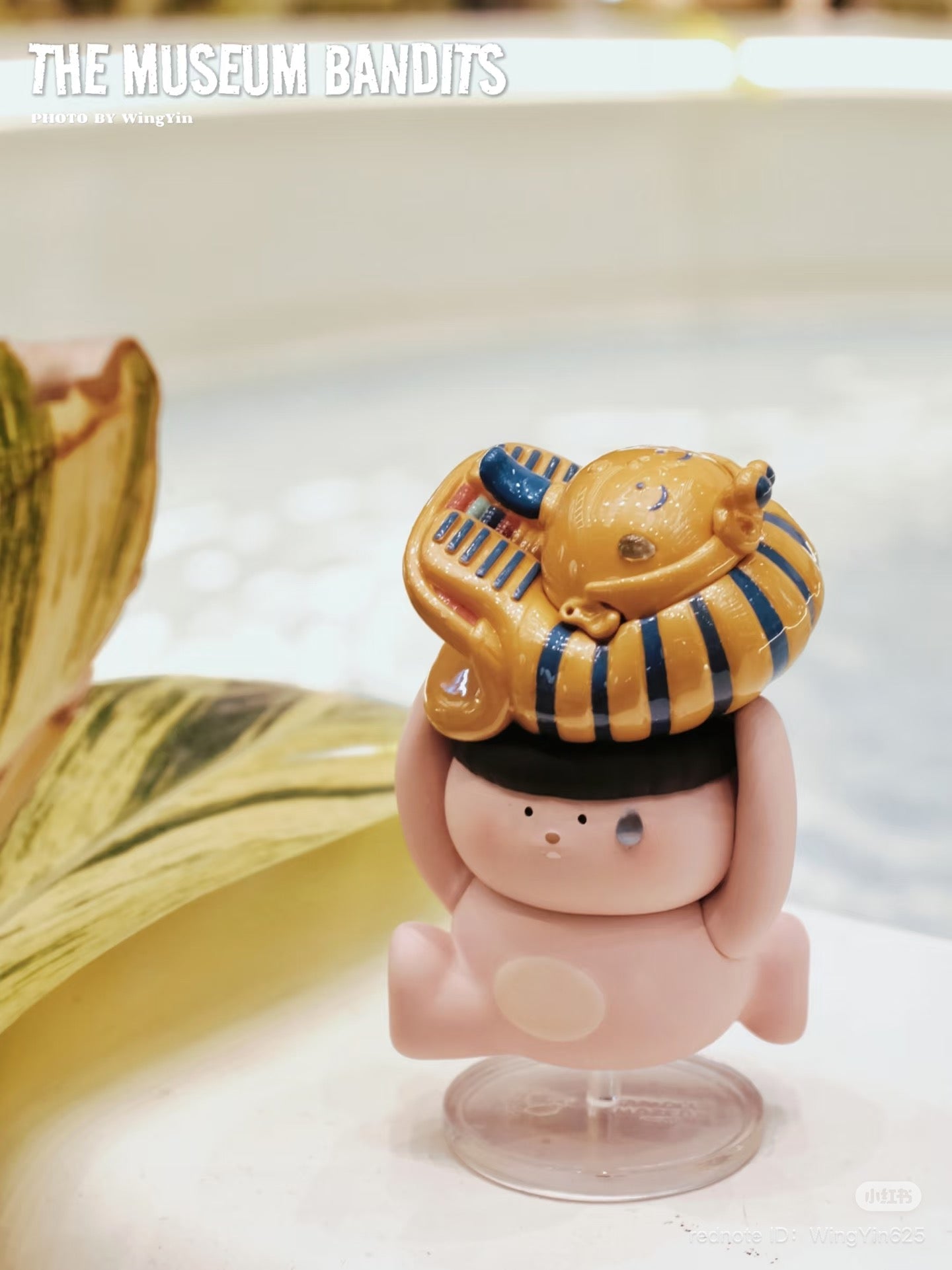 Museum Thief Series Blind Box - Preorder. Features close-up of a figurine on a stand. Part of a collectible art toy series. Ships Aug 2025.