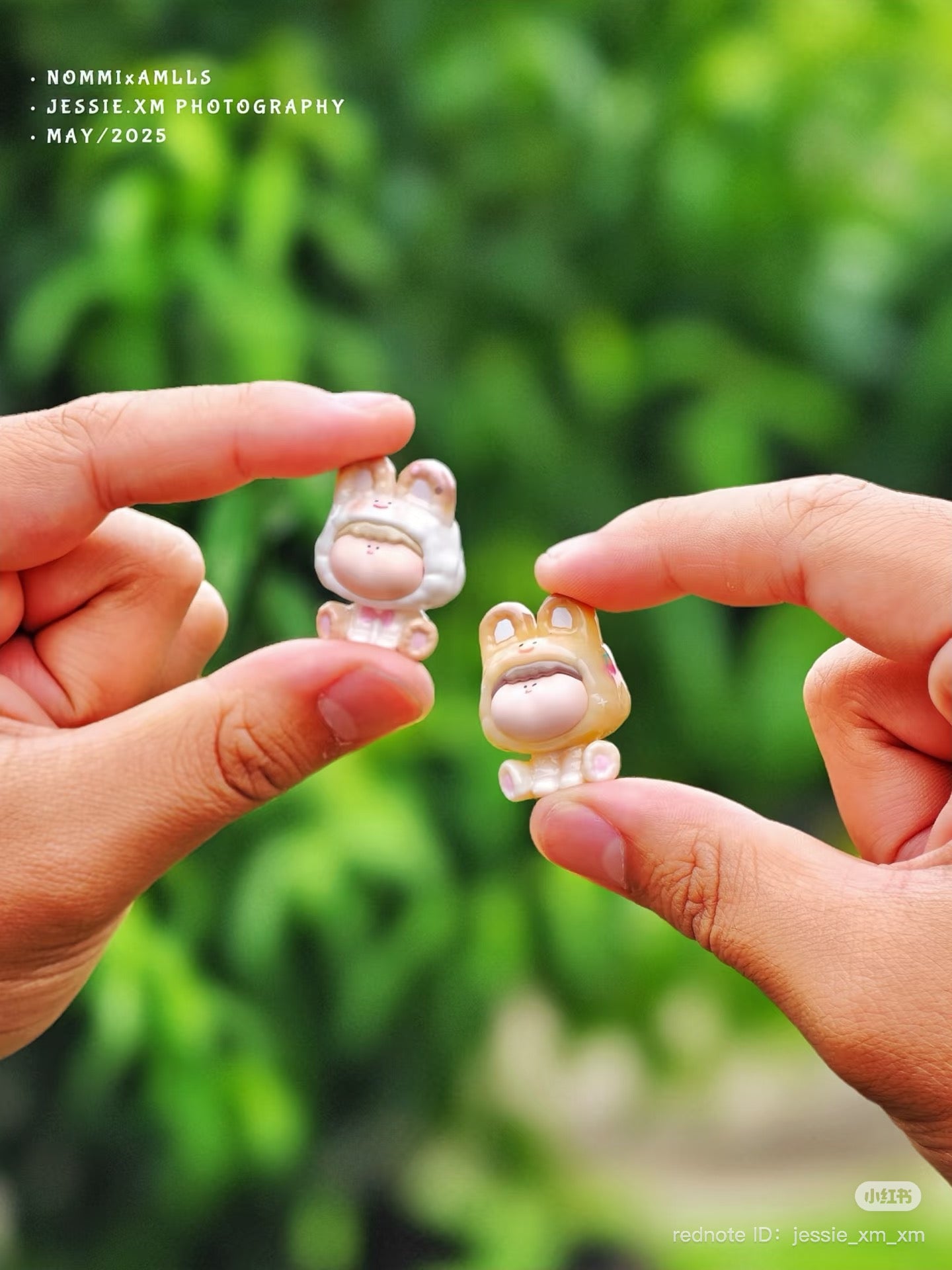 Close-up of a finger holding a Nommi Eat Sweets Series Plush Keychain Blind Box from Strangecat Toys, available for preorder, shipping July 2025.