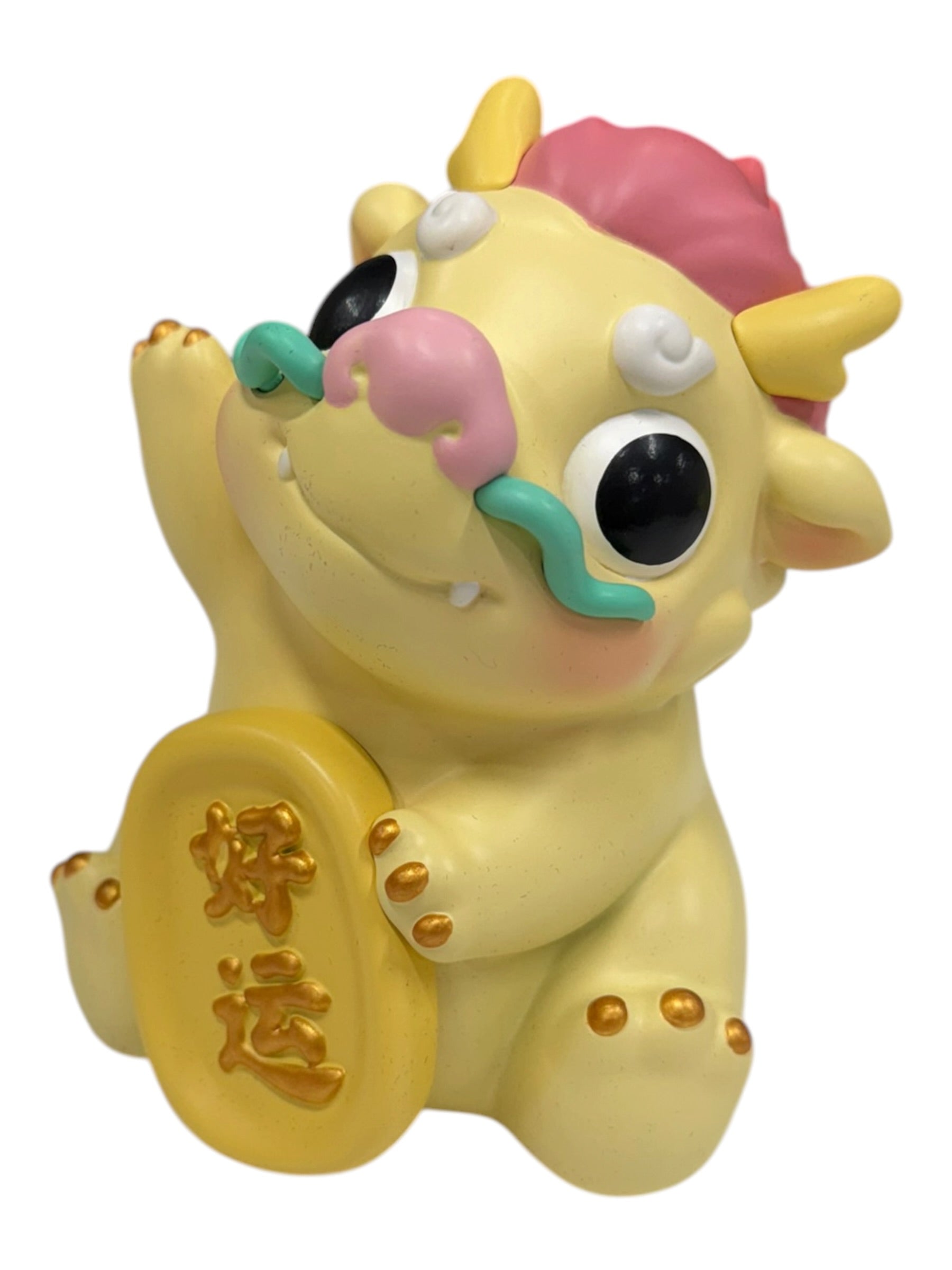 Kemelife Long figurine: a stylized dragon-ox creature with pink mane, teal mustache, gold ingot, symbolizing prosperity.