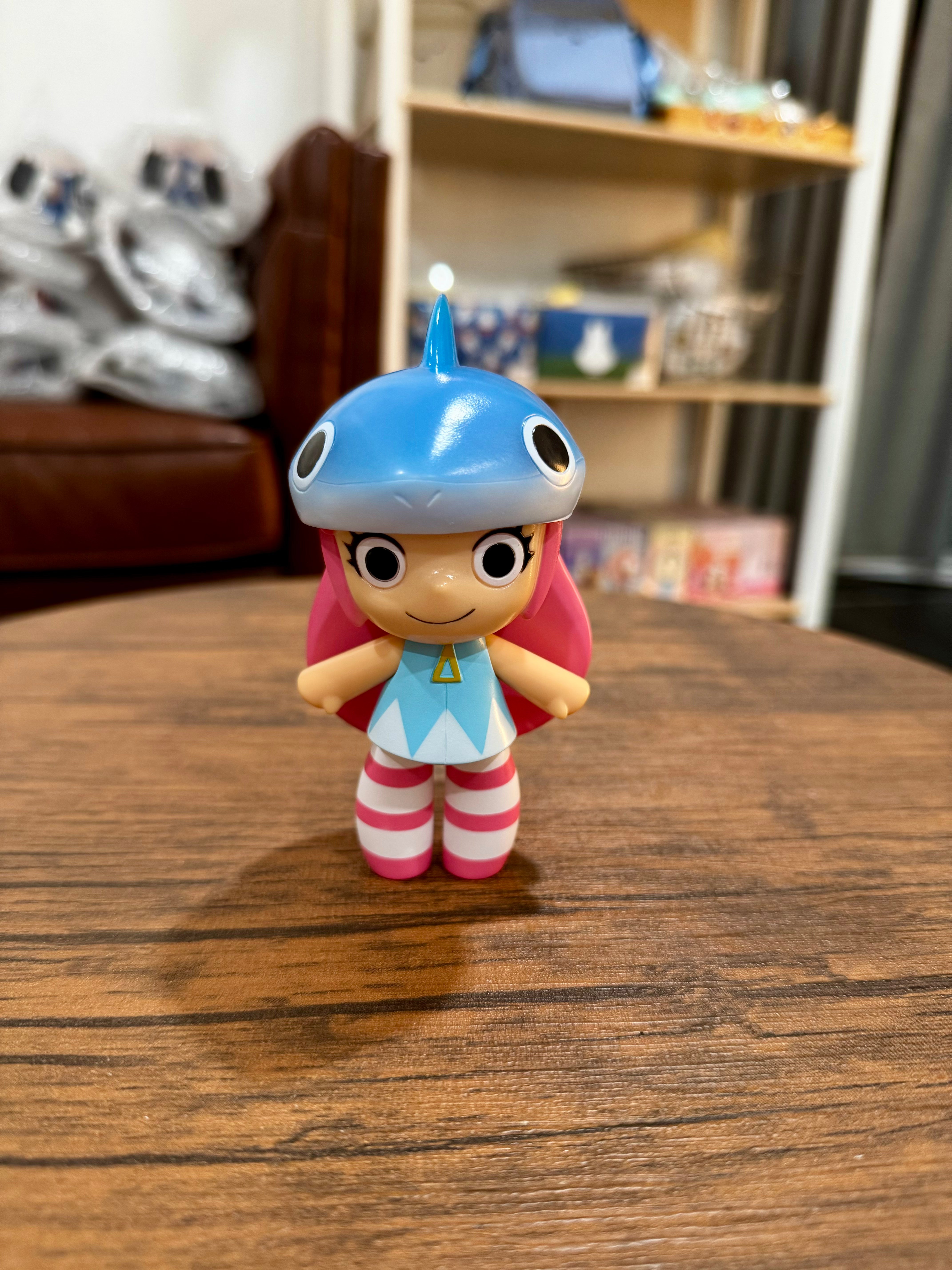 Shamerot by Red Shark, a 11.5cm sofubi toy figurine depicting a girl, showcased on a table, ideal for collectors of unique art toys.