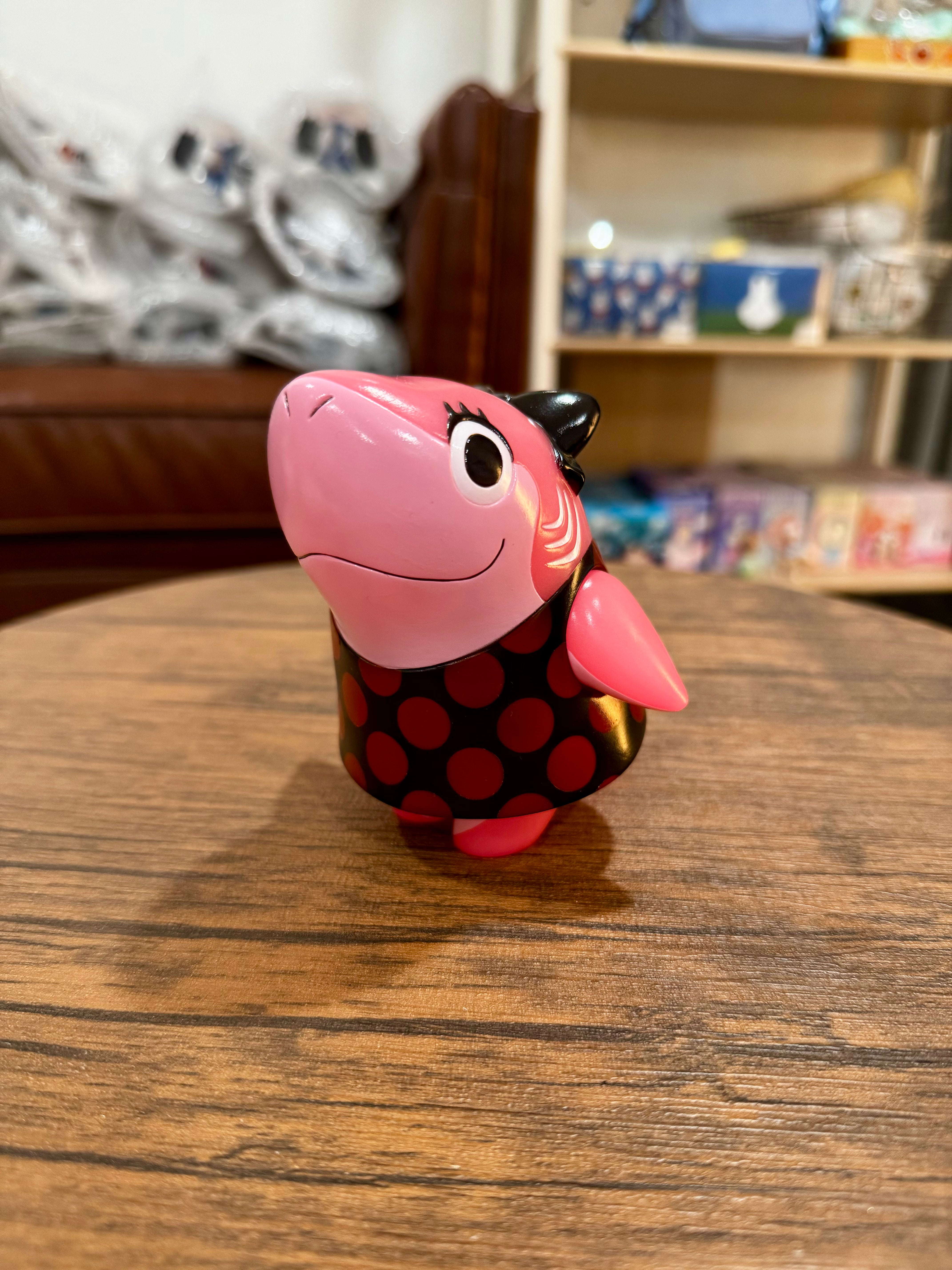 Shark Girl Evil Dress by Red Shark, a 11.5cm sofubi toy with black and red polka dots, displayed on a wooden surface.