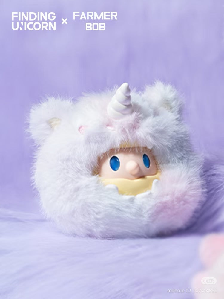 FARMER BOB Mini - DRAGON MIRAGE SERIES: A collectible toy in a unicorn costume, showcasing a cute face. Part of a limited, artist-designed blind box series.