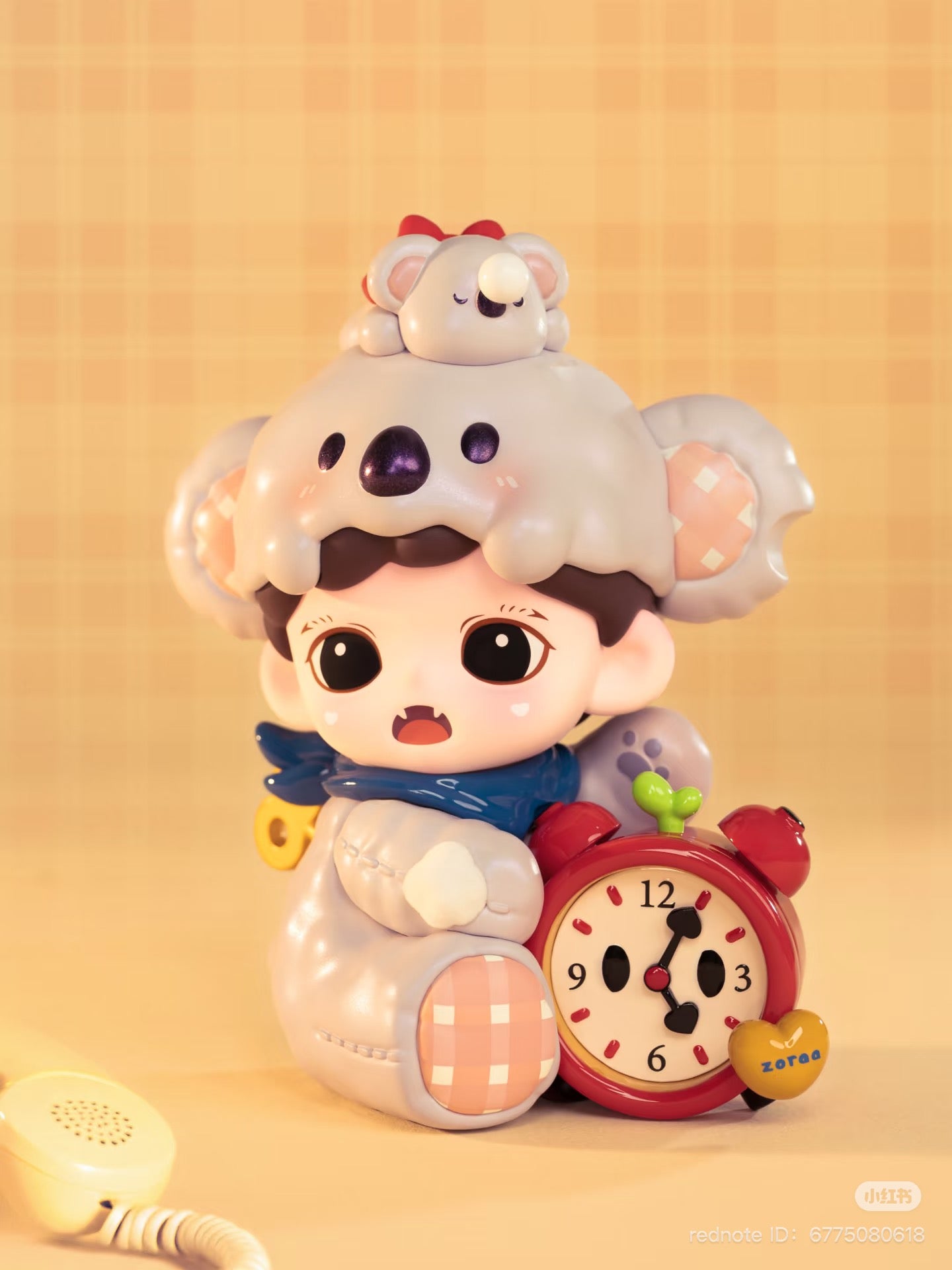 Zoraa Cuteness is Justice Series Figures Blind Box featuring a toy telephone receiver, yellow heart, and purple object, available for preorder at Strangecat Toys.