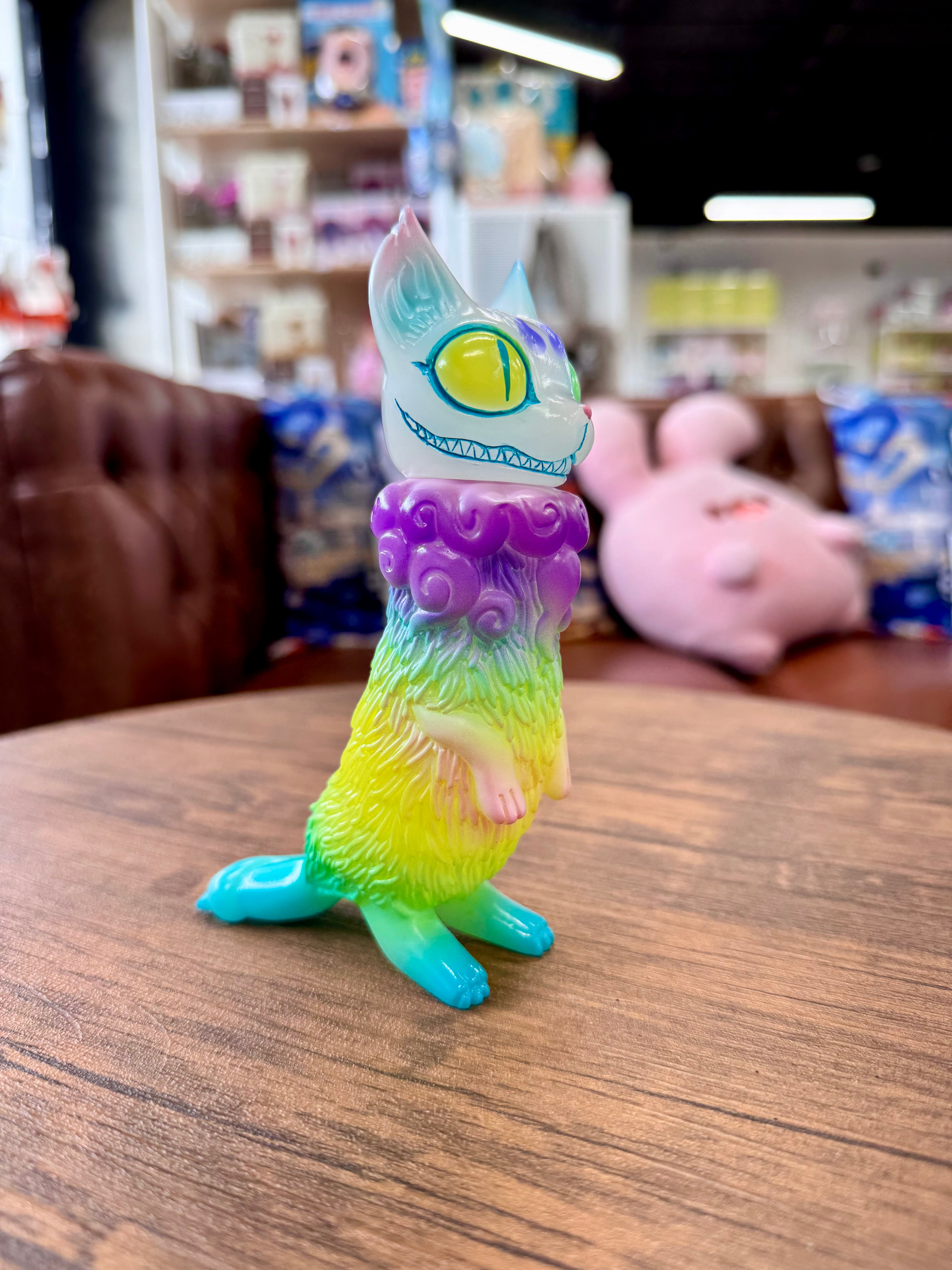 Bakeneko Pastel by YASU: A 14cm Japanese Sofubi, depicting a wooden animal cartoon figure, showcased as a collectible art toy from Strangecat Toys.