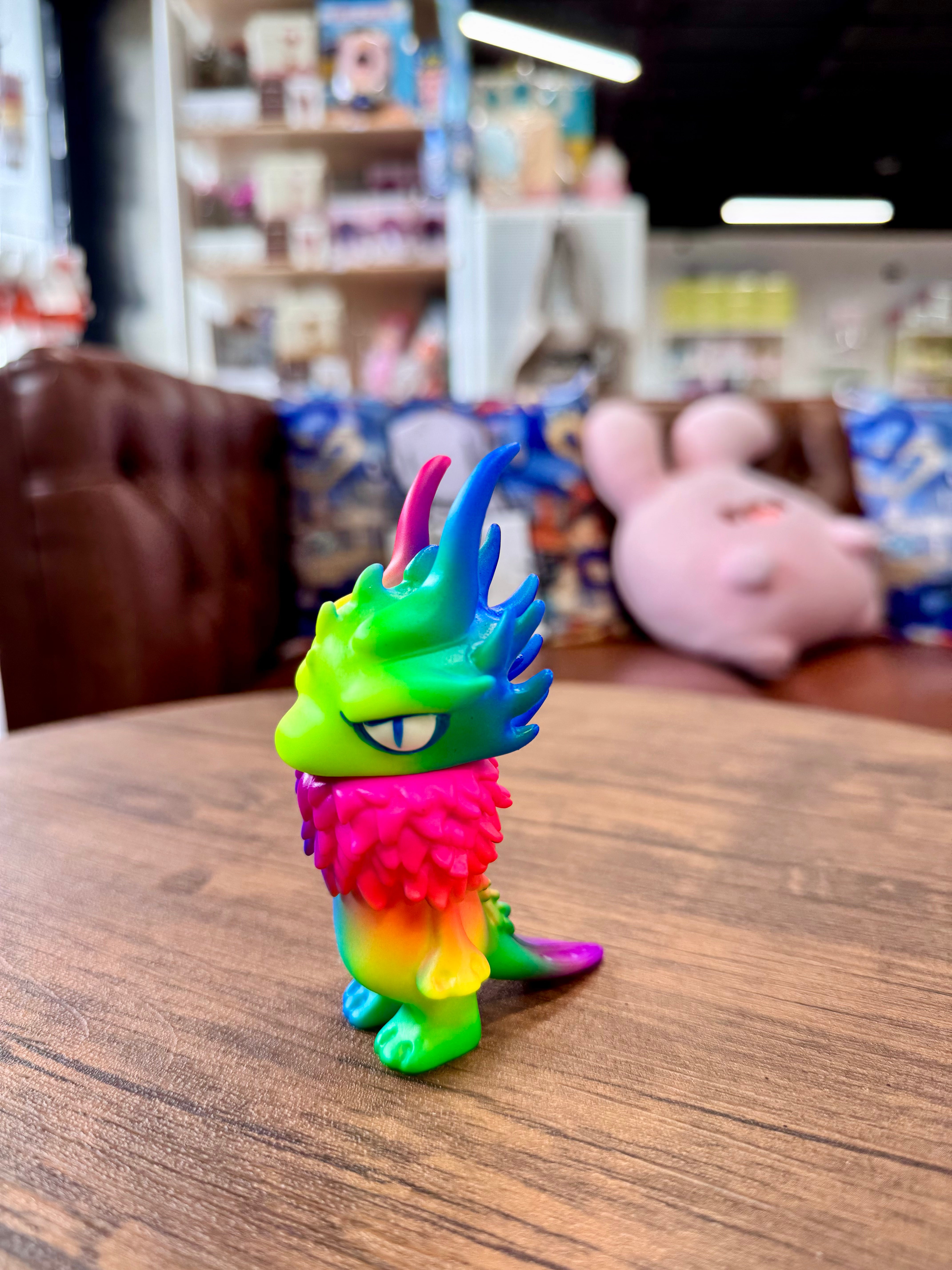 Gekko Dragon Fluorescent Color by YASU, a Japanese Sofubi figure, depicted as an animal toy indoors, reflecting Strangecat Toys' artful collection.