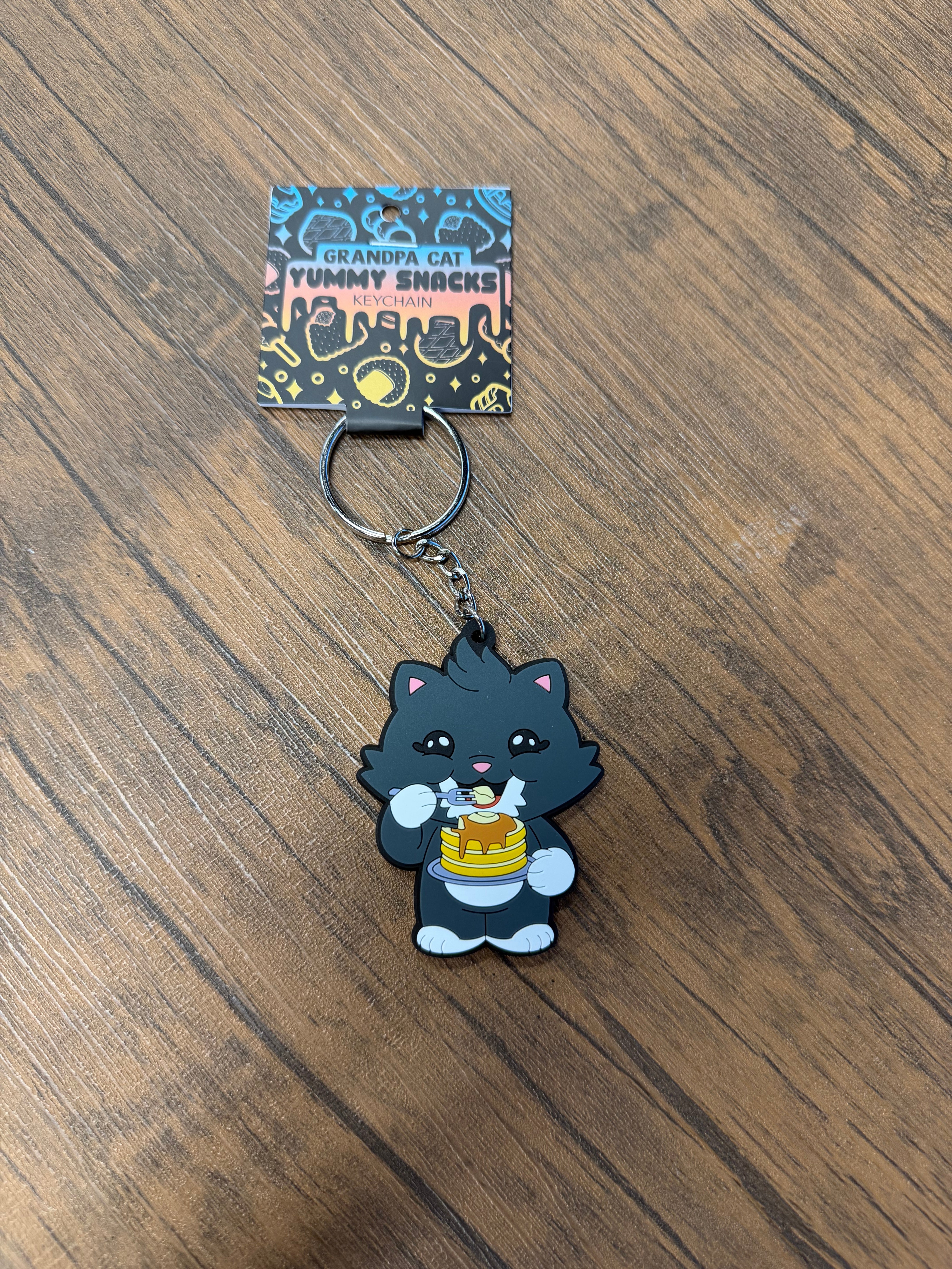 Grandpa Keychain - Japanese Snack Series: Cartoon cat with pancakes on a backing card, highlighting snack-themed novelty from Strangecat Toys.