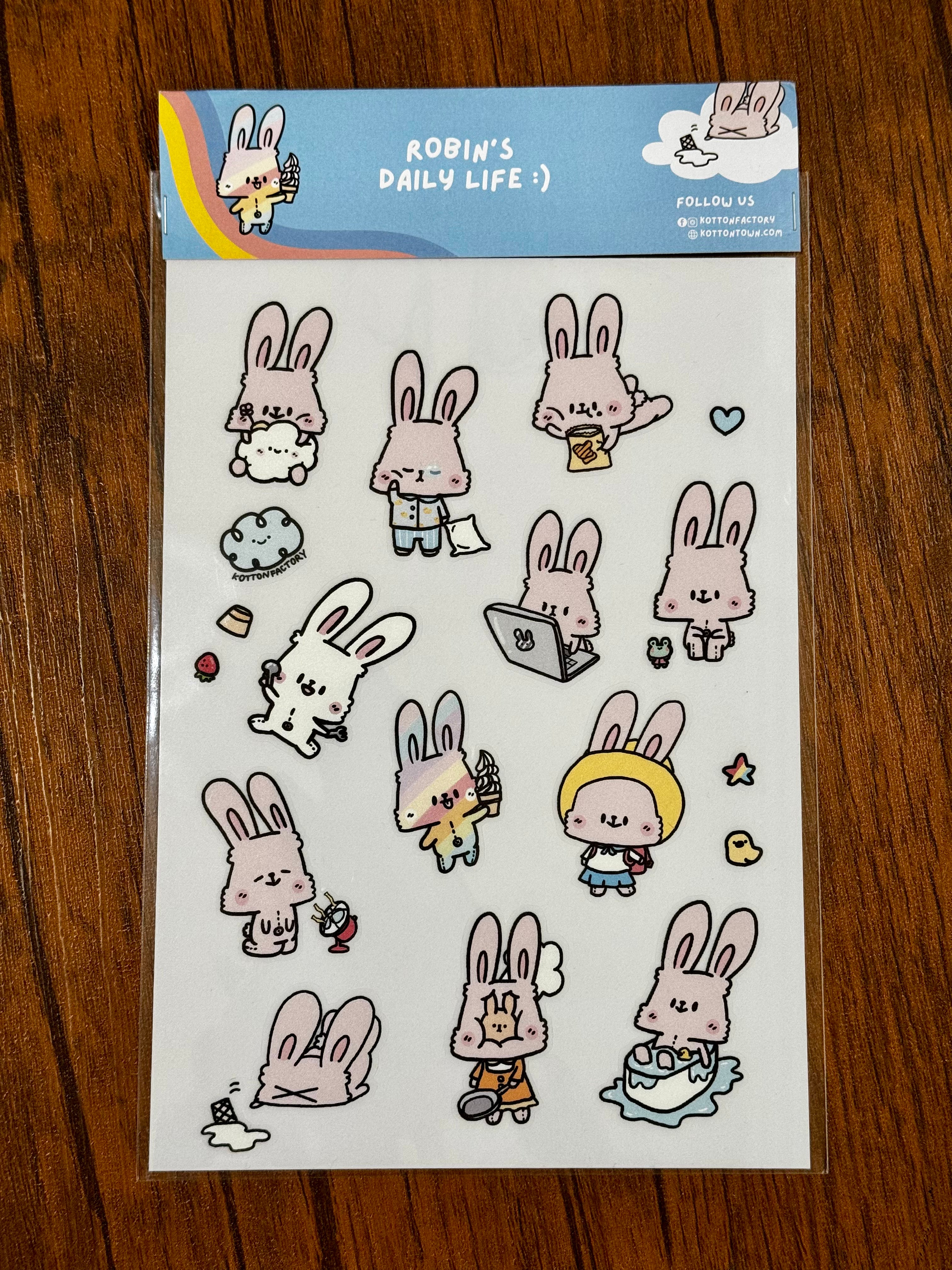 Robin's Daily Life Sticker Sheet by Kotton Factory features cartoon rabbits, including one holding ice cream, perfect for art toy enthusiasts.