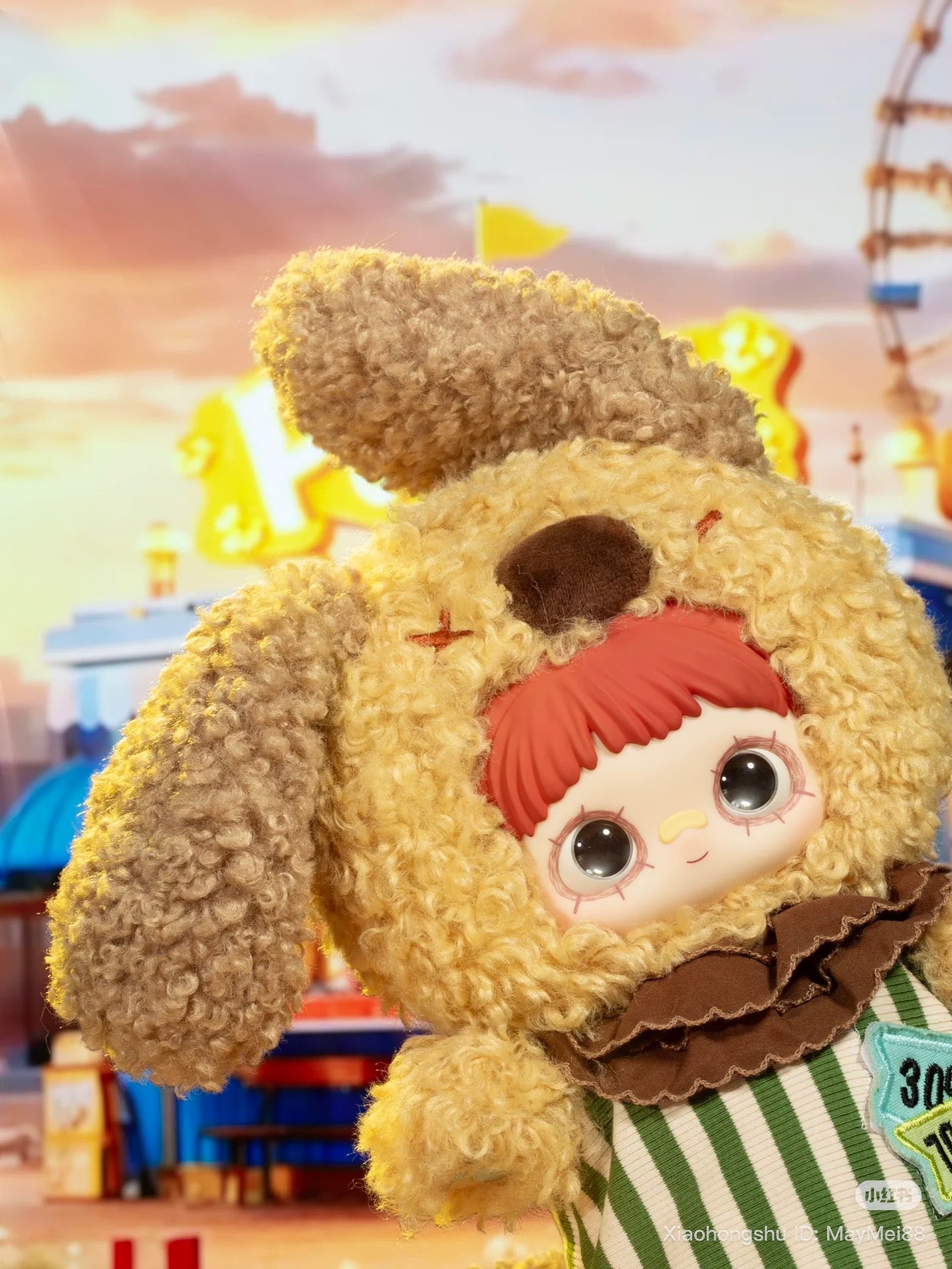 Maymei 400% Forgotten Funfair Plush Keychain Blind Box featuring a big-eyed doll in a bunny costume with a carnival backdrop. Preorder for July 2025.