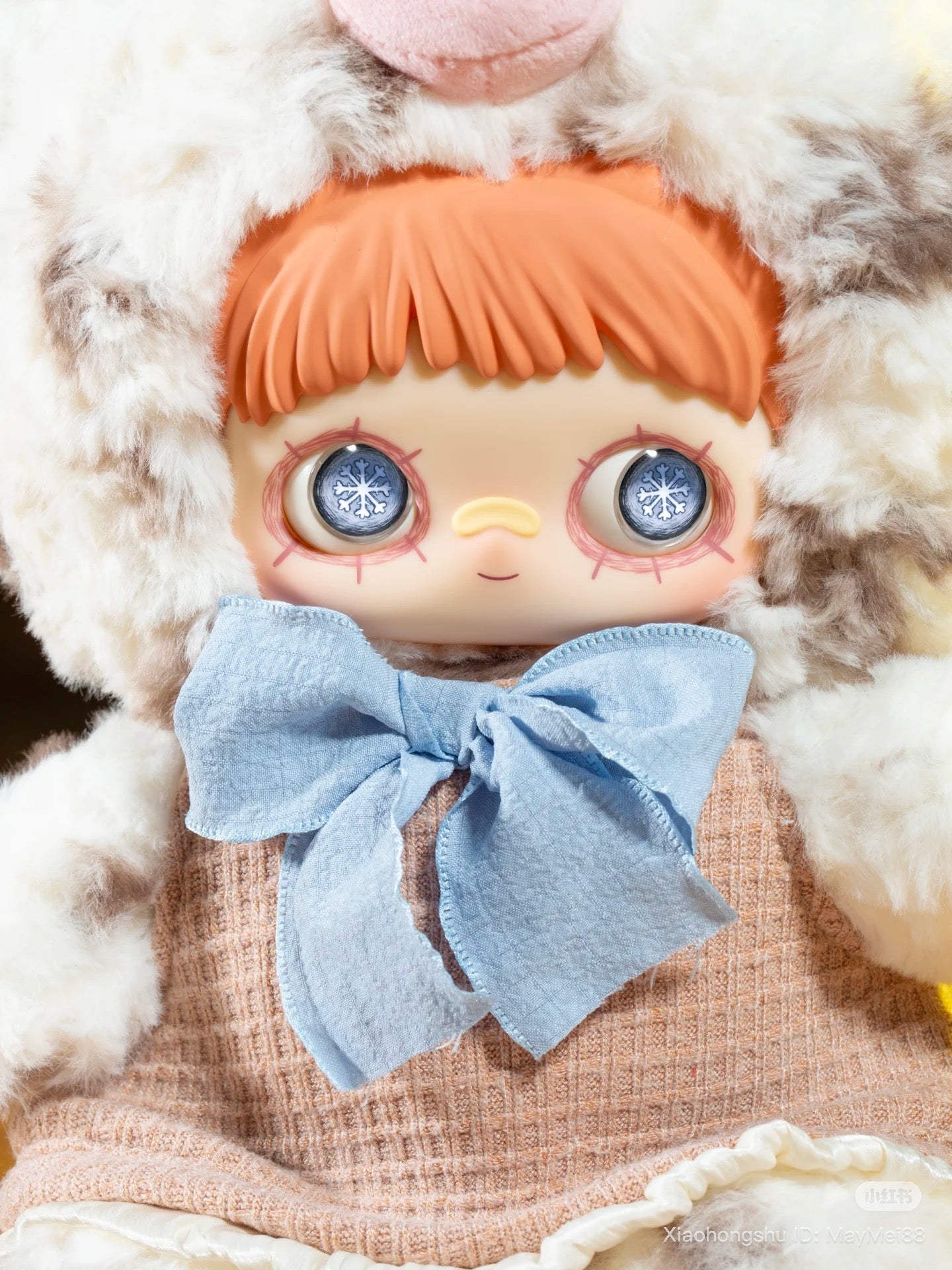 Maymei 400% Forgotten Funfair Plush Keychain Blind Box doll with orange hair, animal-style hood, snowflake eyes, and a pale-blue bow.