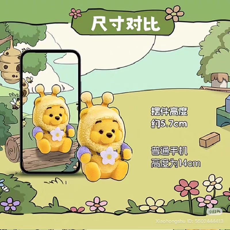 Winnie-the-Pooh figurine in bee costume, 5.7cm tall, shown alongside smartphone outline for size comparison. Disney Winnie heart garden Blind Box Series preorder.