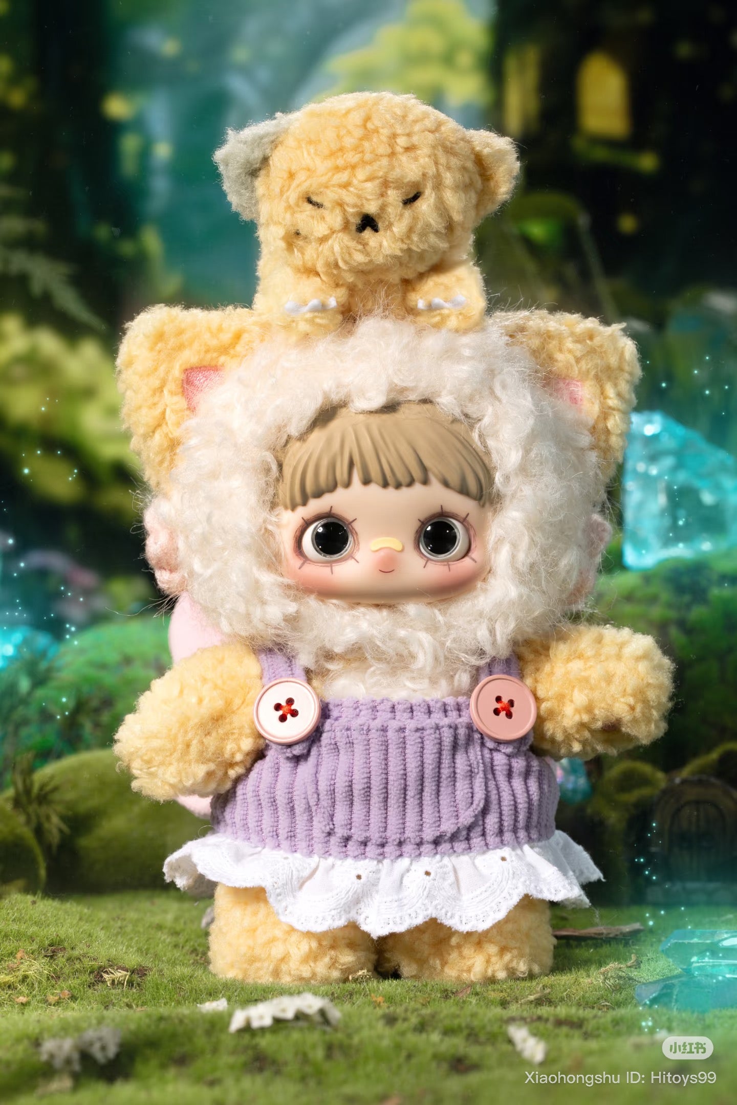 MayMei Symbiote Neverland Series keychain plush in cat onesie on forest floor, surrounded by glowing crystals, featuring a sleepy plush on its head.