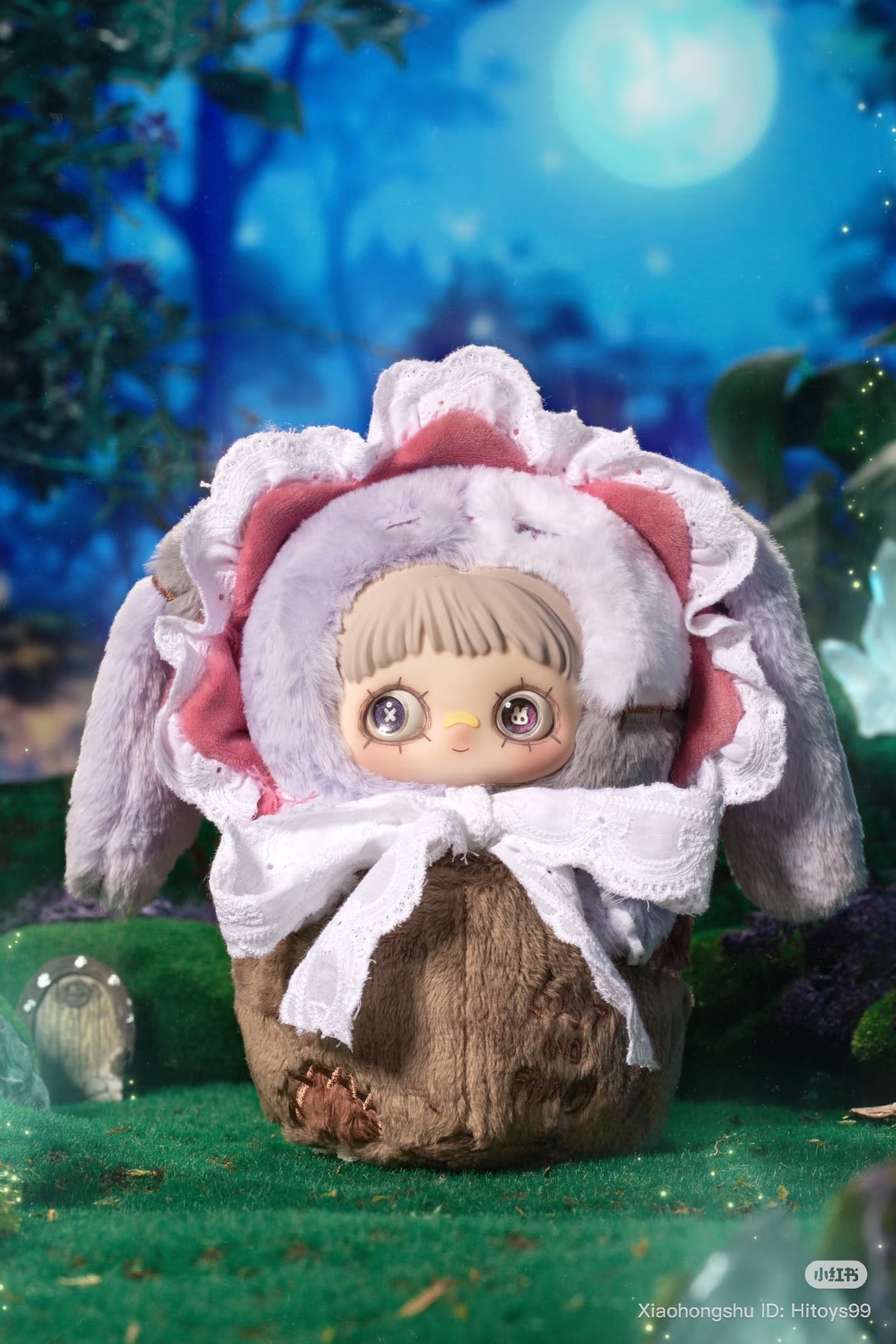 MayMei Symbiote Neverland Series Vinyl Keychain Plush Blind Box featuring a bunny-eared doll with button eyes on a mossy, moonlit forest setting.