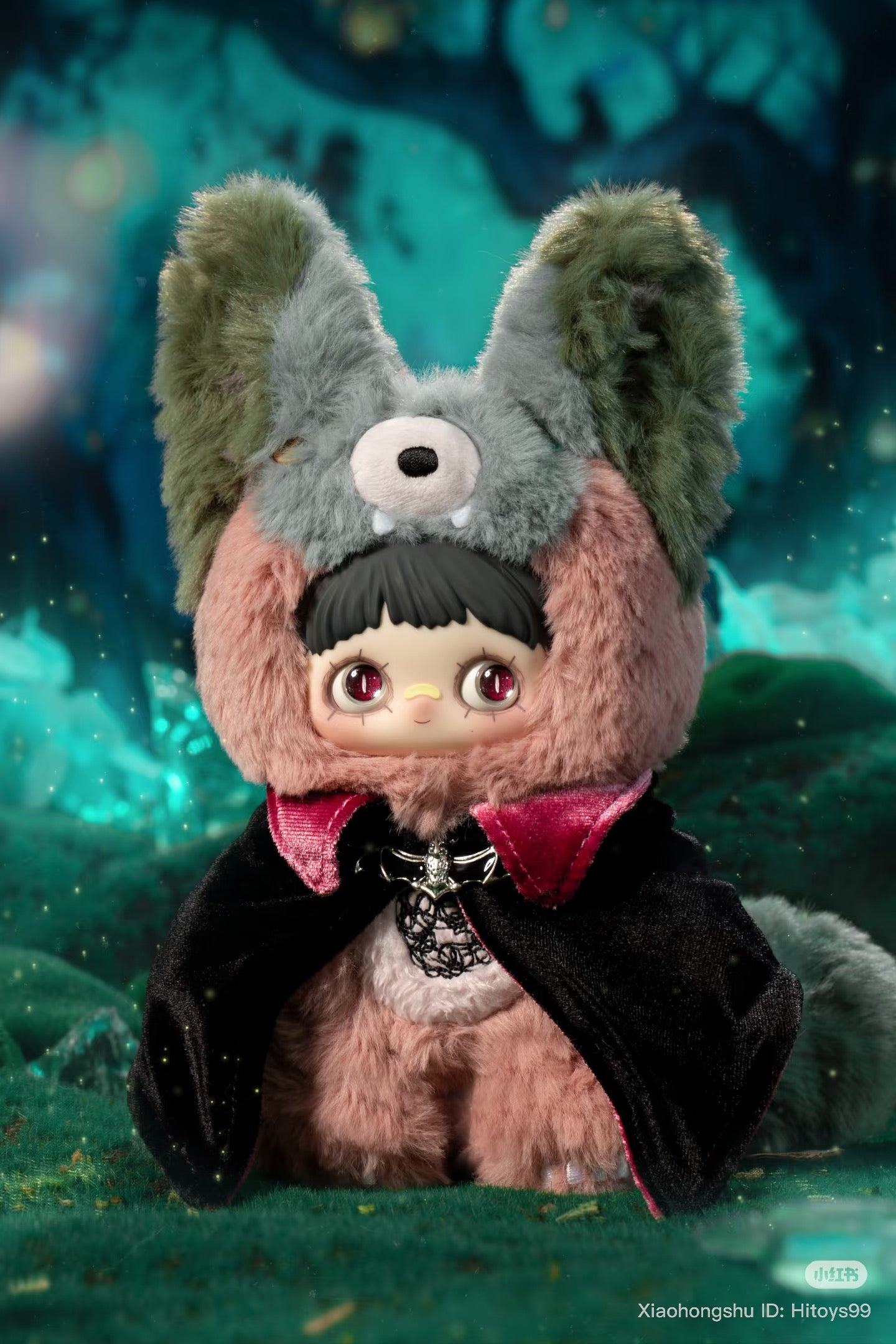 MayMei Symbiote Neverland Series vinyl keychain plush, styled as a cute fantasy woodland creature with a velvet cape and furry animal hood.