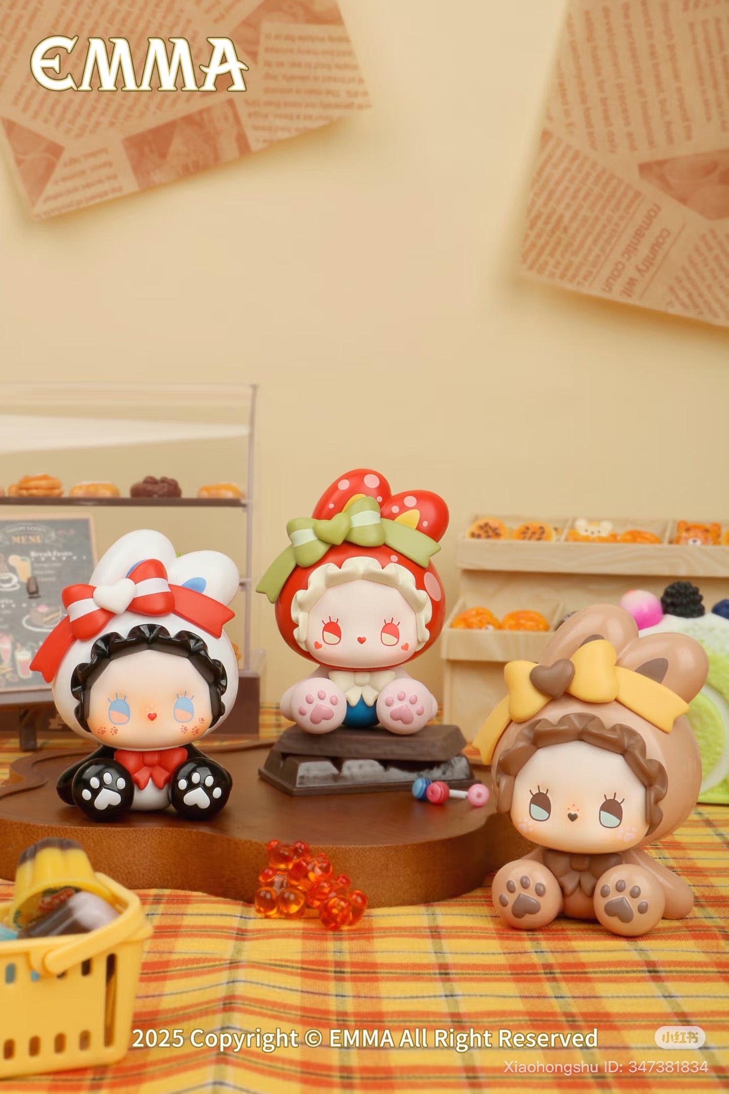 Emma Bunny Collector Mini Blind Box Series figures in a tabletop bakery scene with pastries and props, featuring strawberry, bear, and bunny-themed hoods. Preorder now.