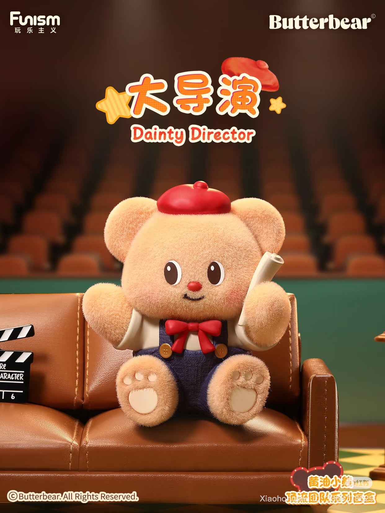 Butterbear's Dainty Director plush from the Top Team Series Blind Box, featuring a teddy bear in a beret with a script, seated on a couch.