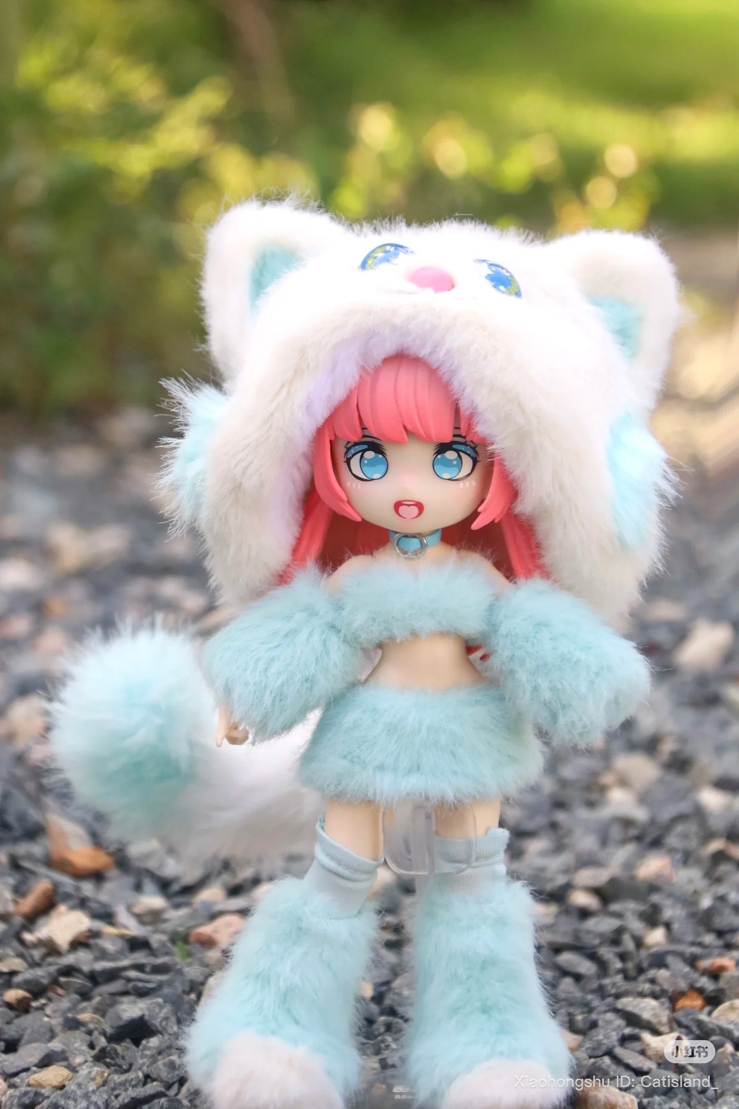 Anime-inspired doll in a pastel-blue cat outfit from Cat Island-Black Cat Or Candy Cat Series, available for preorder, posed outdoors on gravel.