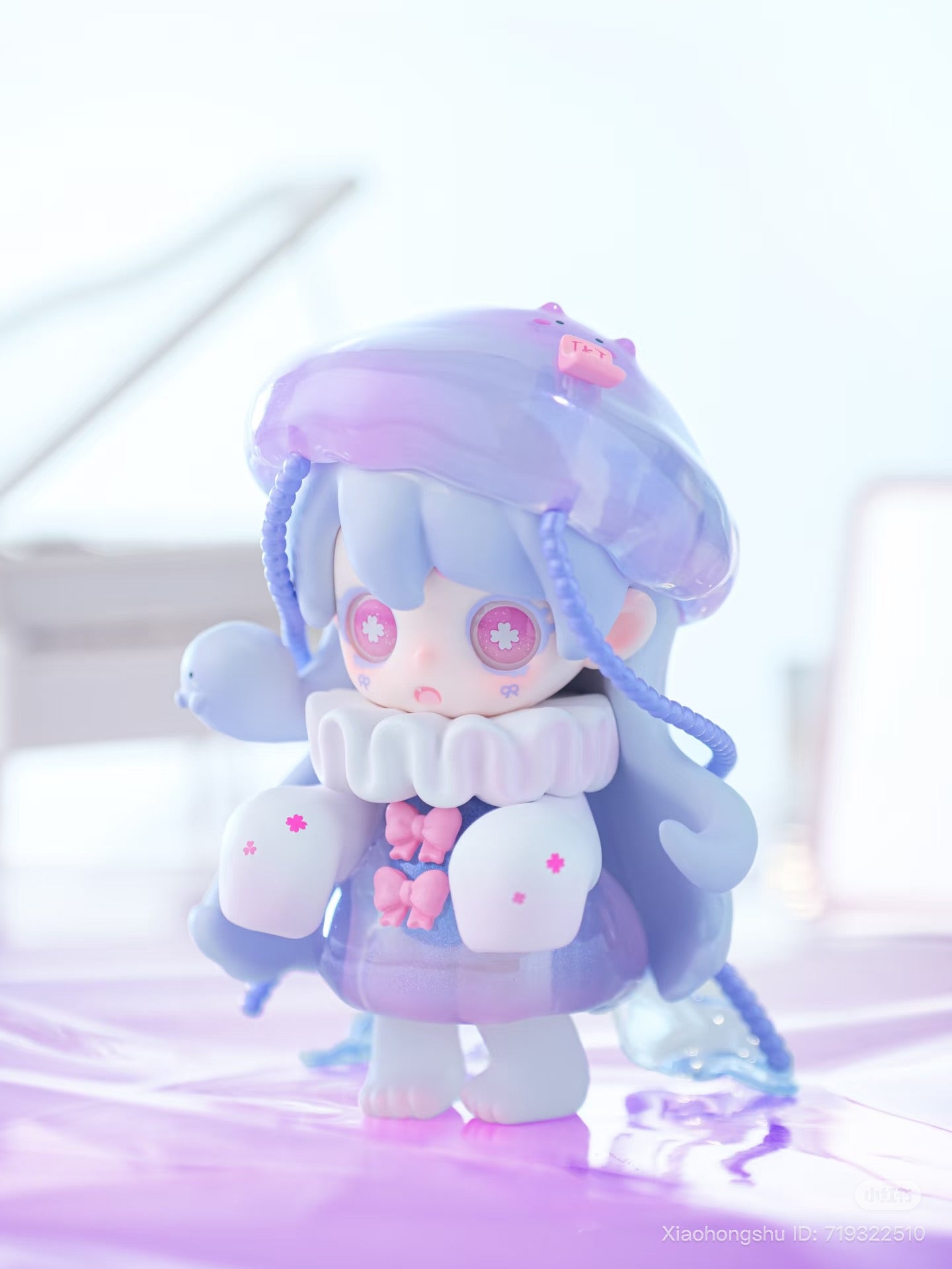 Keeno·Wish On The Sea Breeze Series Blind Box collectible, featuring a chibi figure with braided pigtails, translucent beret, and flower-decorated attire, emphasizing a dreamy, kawaii aesthetic.