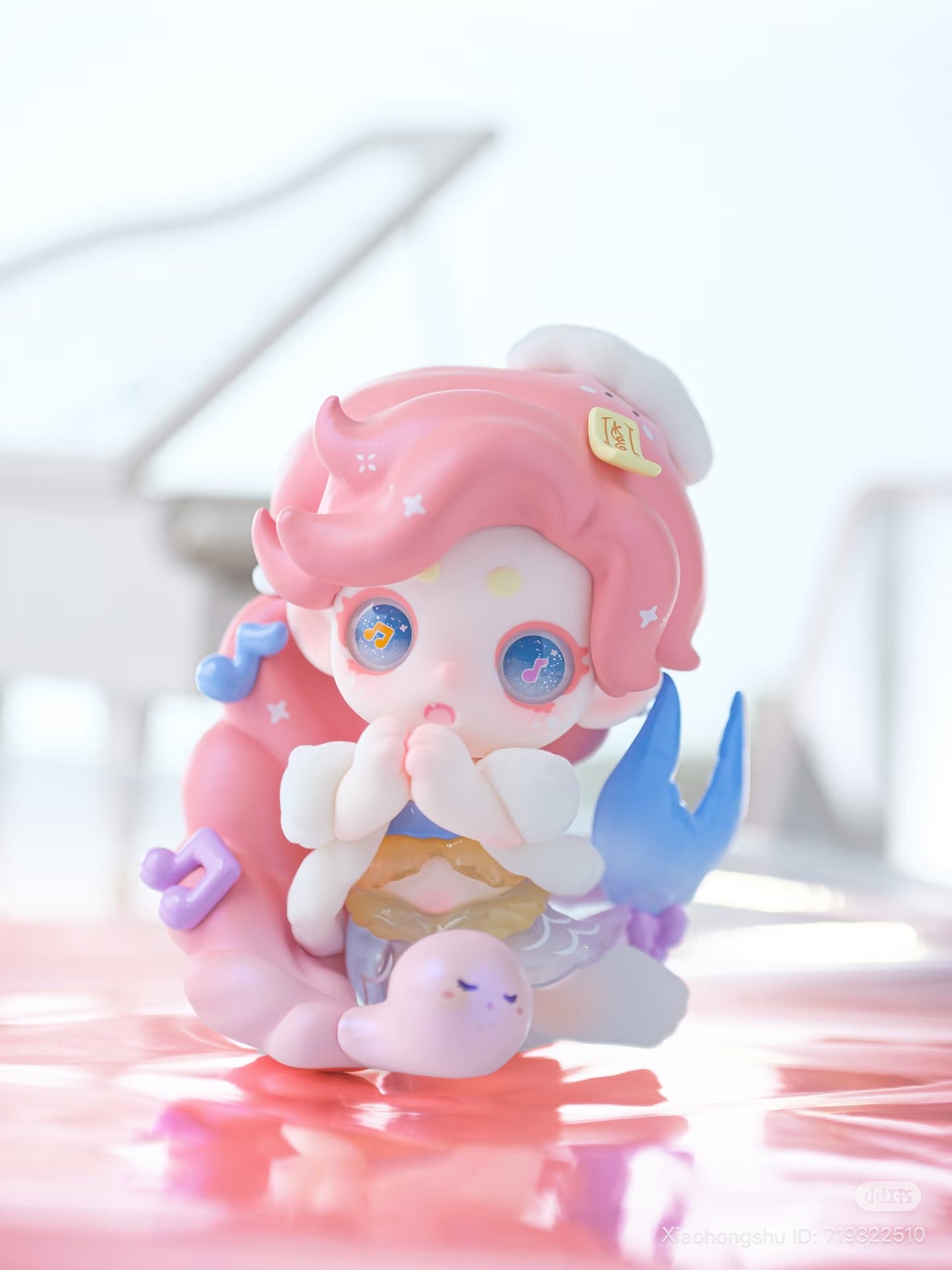 Keeno·Wish On The Sea Breeze Series Blind Box features a chibi mermaid figurine with sparkly eyes, pink hair, and a smiling sea-snail companion.
