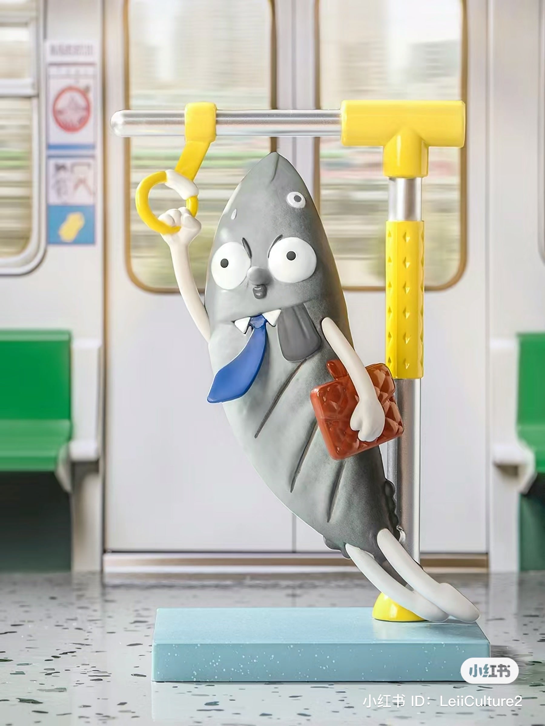 Toy figurine of a cartoon character holding a handle from What the Man Daily Blind Box Series.