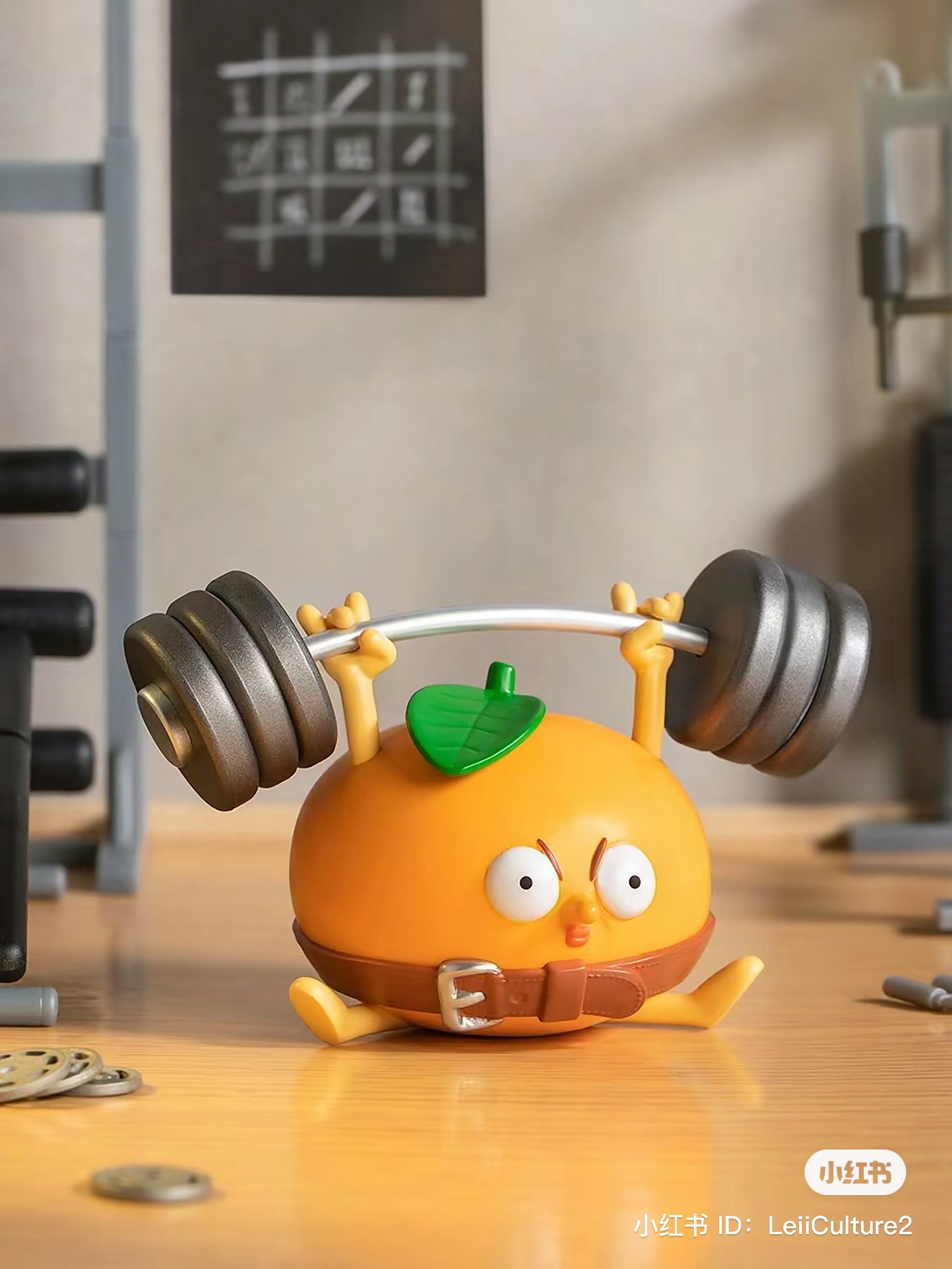 What the Man Daily Blind Box Series: Toy orange with barbell, cartoon character with bar, dumbbell, leaf, and more.