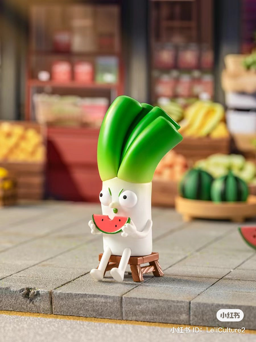 Toy figurine of a vegetable eating watermelon, part of What the Man Daily Blind Box Series, 9-11cm.