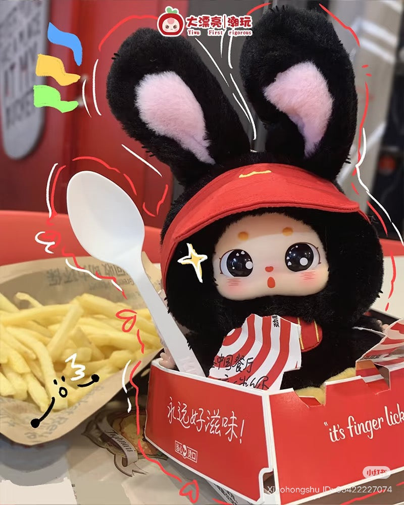 Baby Three - Little Fatty doll in bunny-ear hood sits in fry carton with a spoon, surrounded by fries, part of a collectible preorder series.