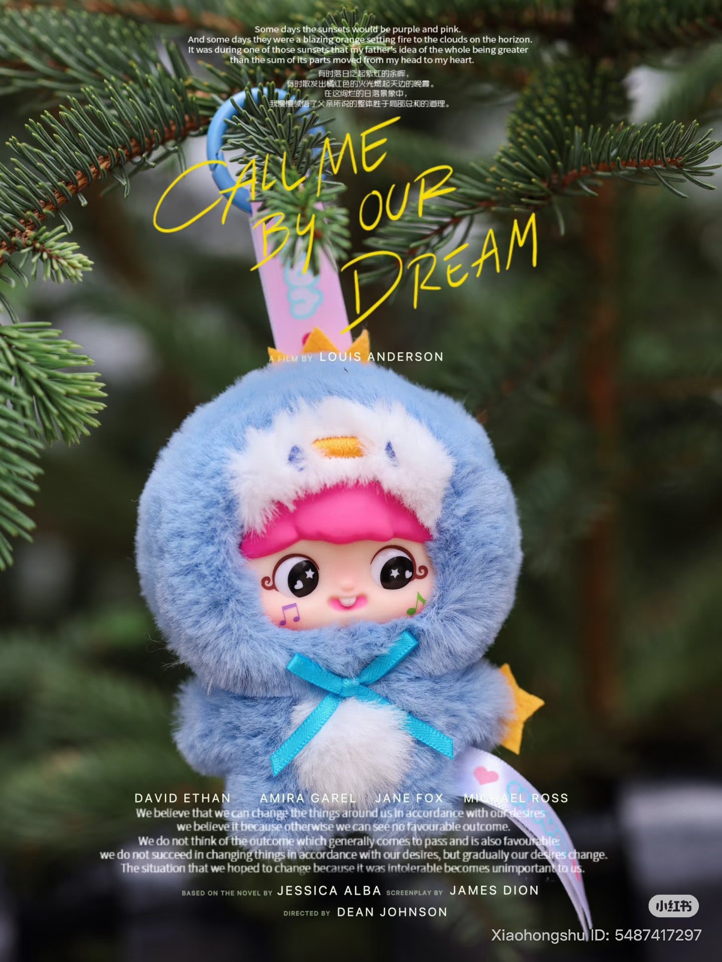 Plush keychain, Baby Three - YAYA's first birthday, in penguin outfit, styled as a whimsical movie poster, hung from a pine branch.