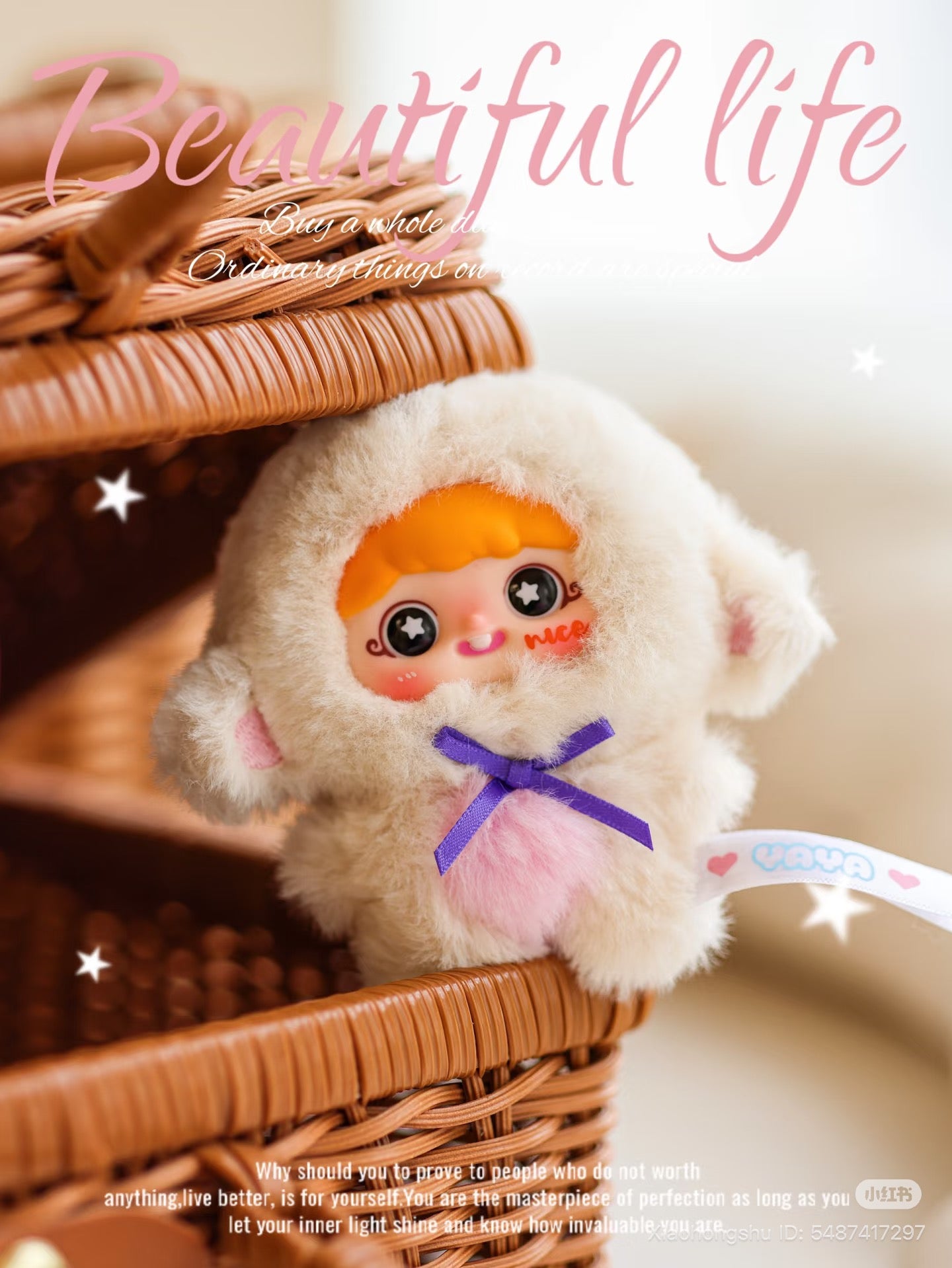 Baby Three plush toy in lamb costume with purple bow, starry eyes, and rosy cheeks sits on a wicker basket. Preorder from Strangecat Toys.