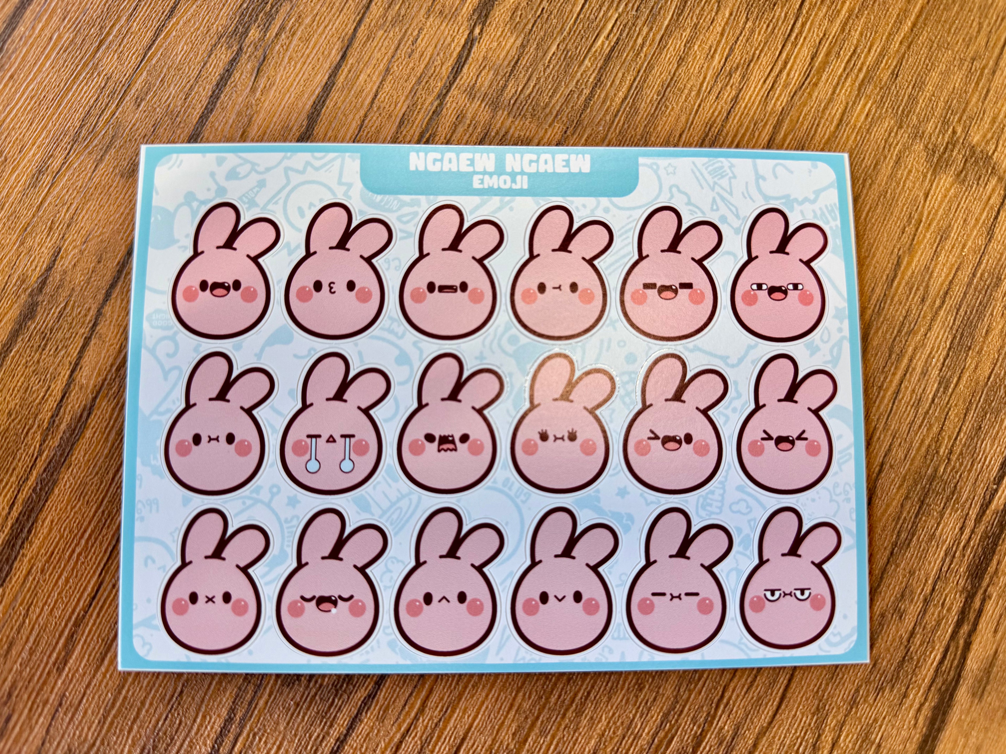 Ngaew Sticker Packs! Series 2 features 20 unique pink bunny emojis, each with different expressions, perfect for adding personality to your surfaces.