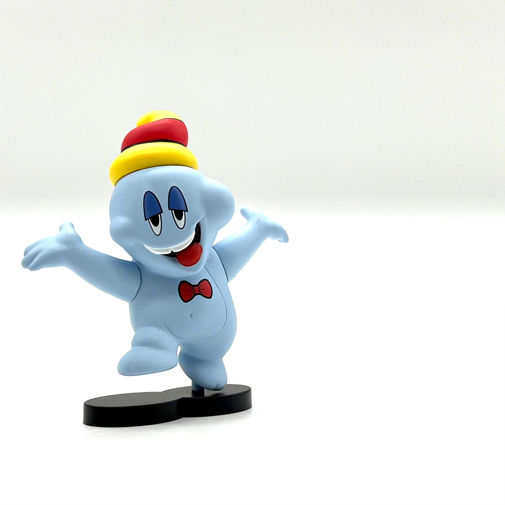 Boo Ripple by Sket-One, a small animal figurine with cartoon eyes and a red bow tie.